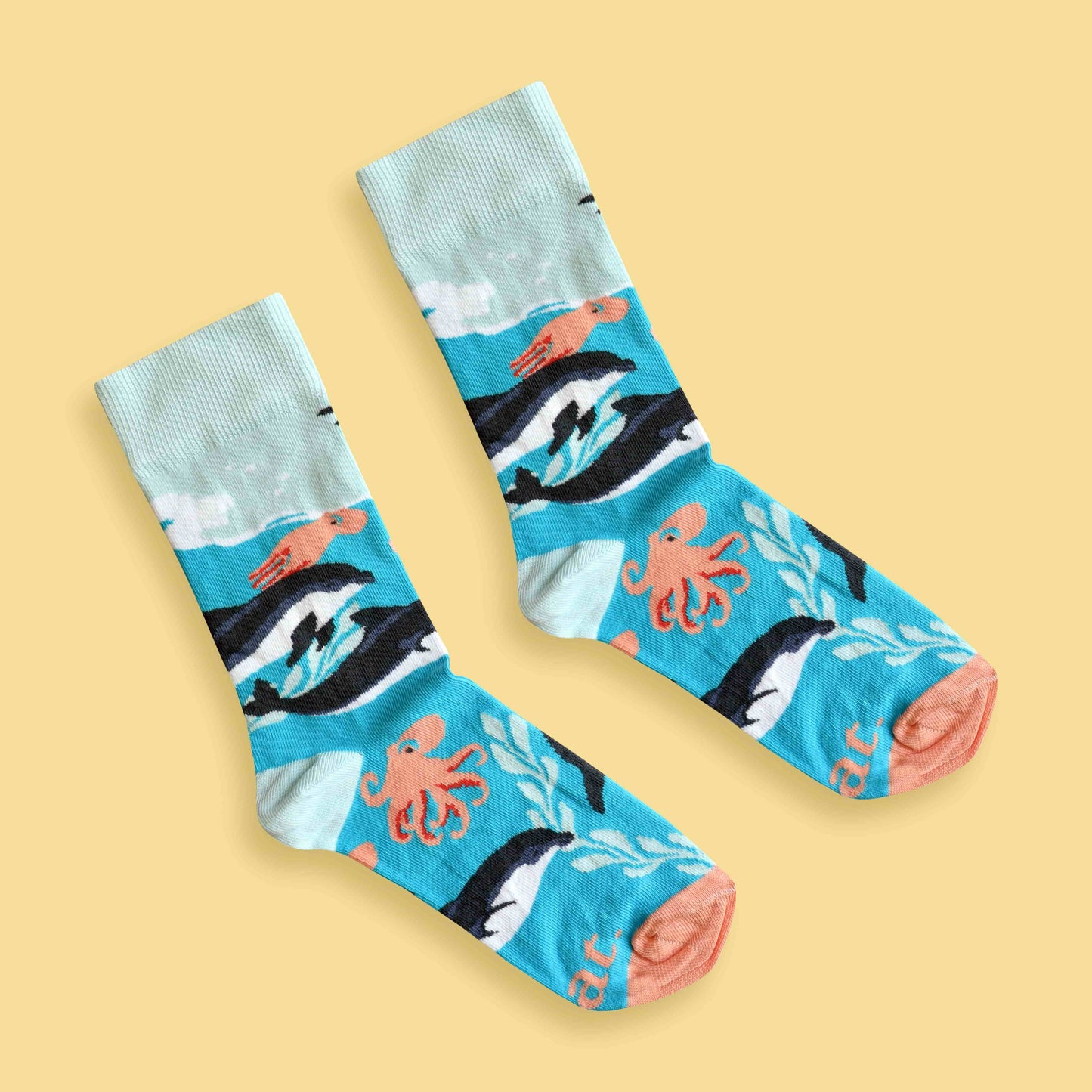 Dolphin party socks yellow background diagonal