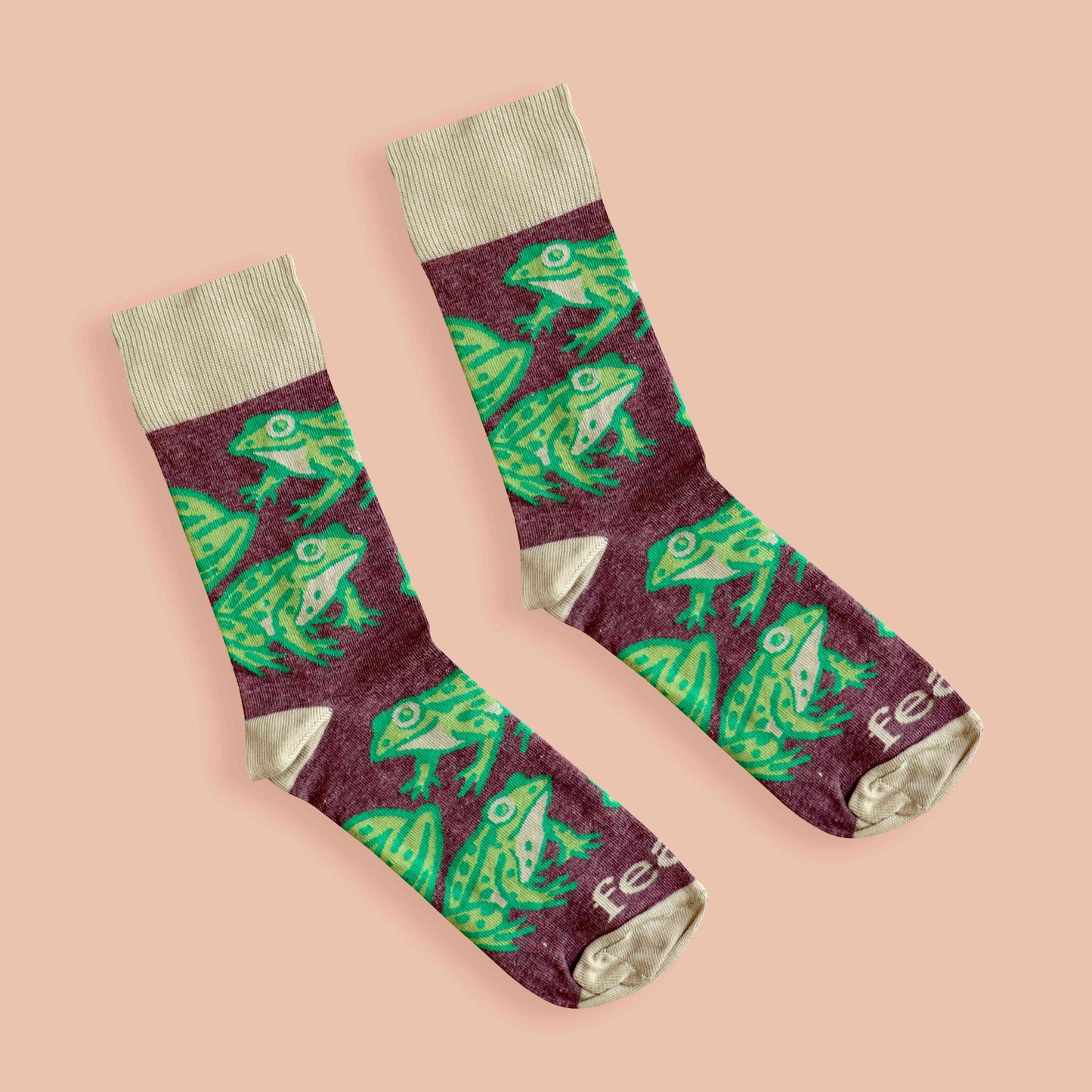 Cape river frog socks peach background diagonal
