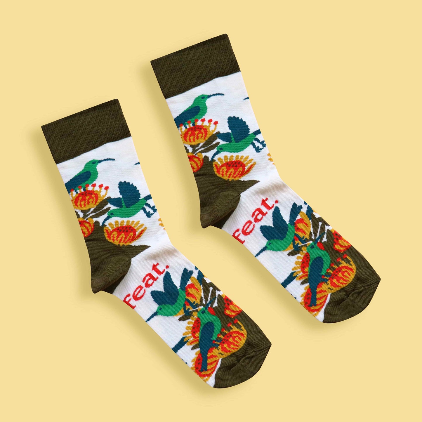 Men’s malachite sunbird socks yellow background diagonal