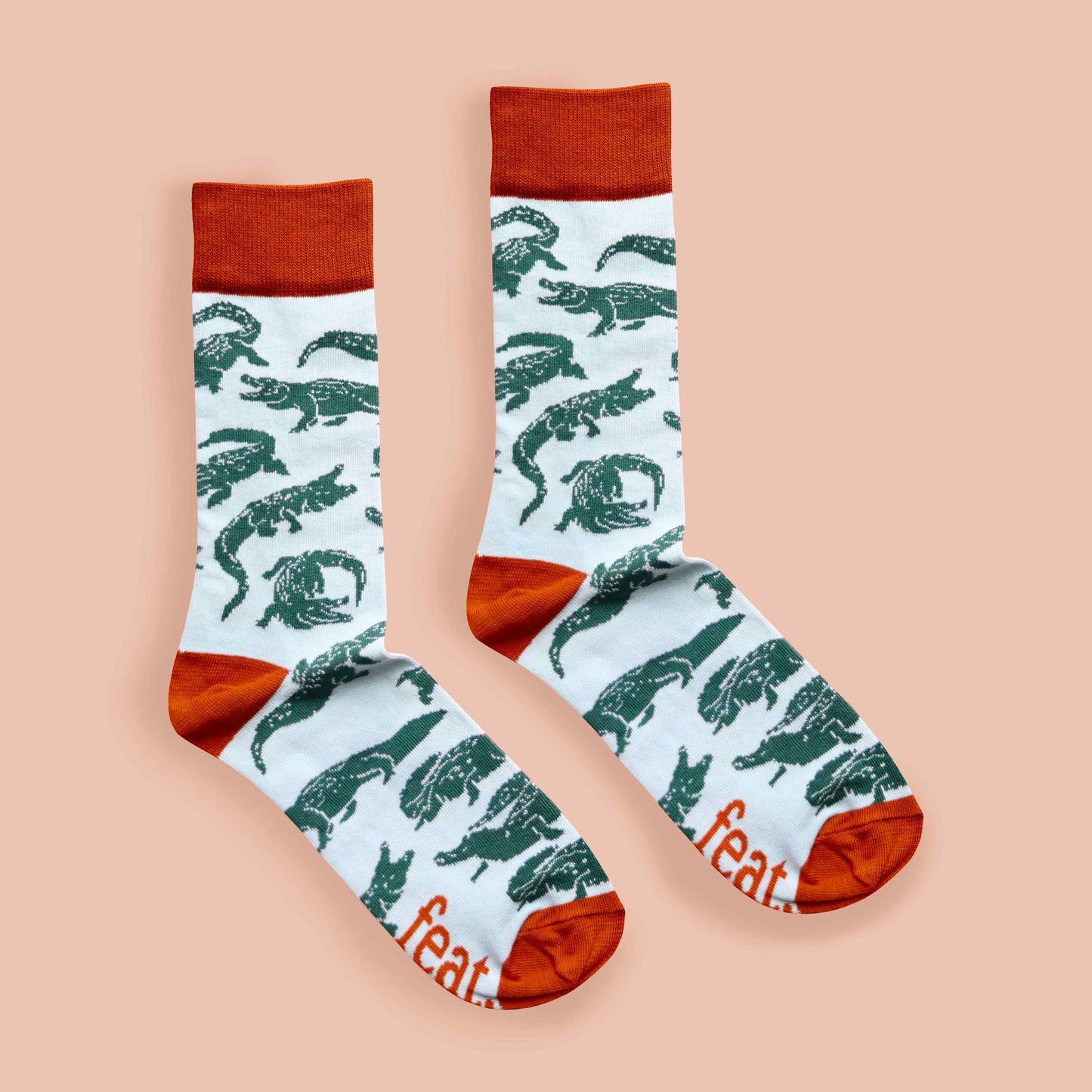 Rust croc socks coral background centered