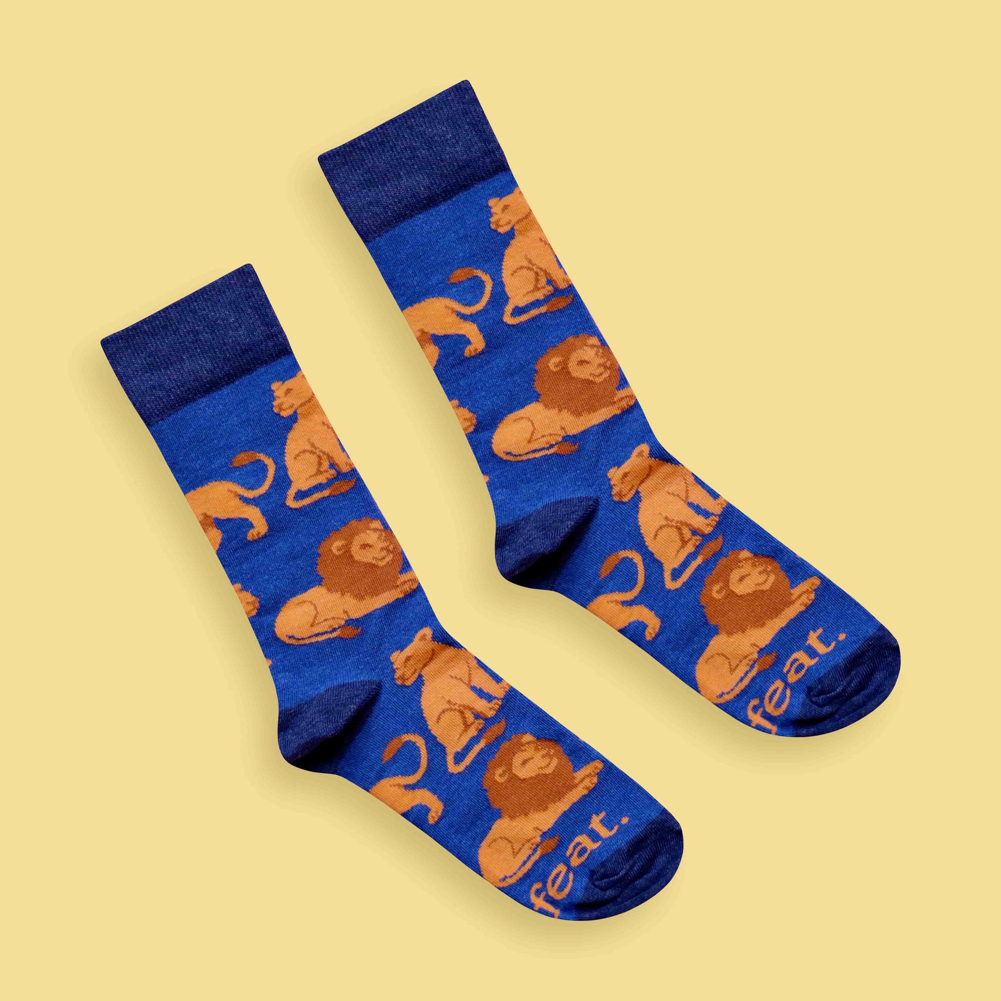 Adults Lion socks yellow background diagonal