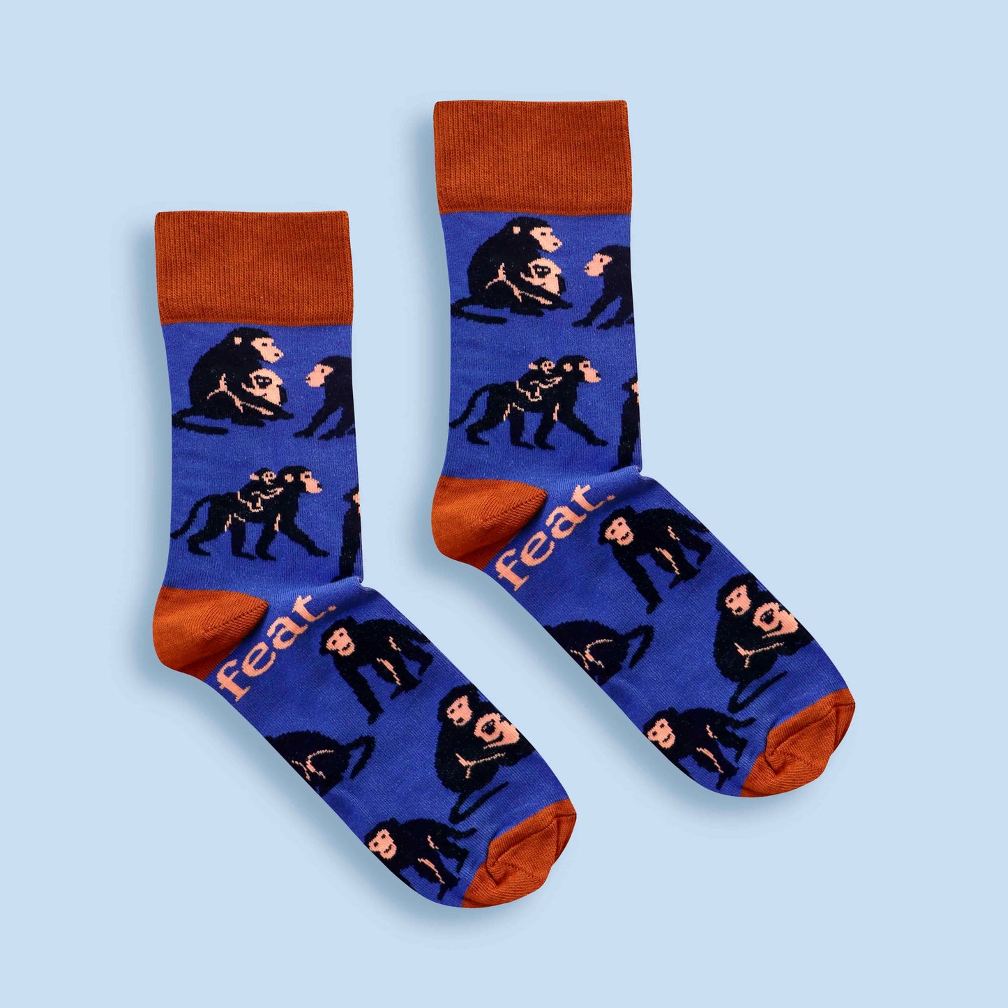 Baboon socks in blue and rust with blue background