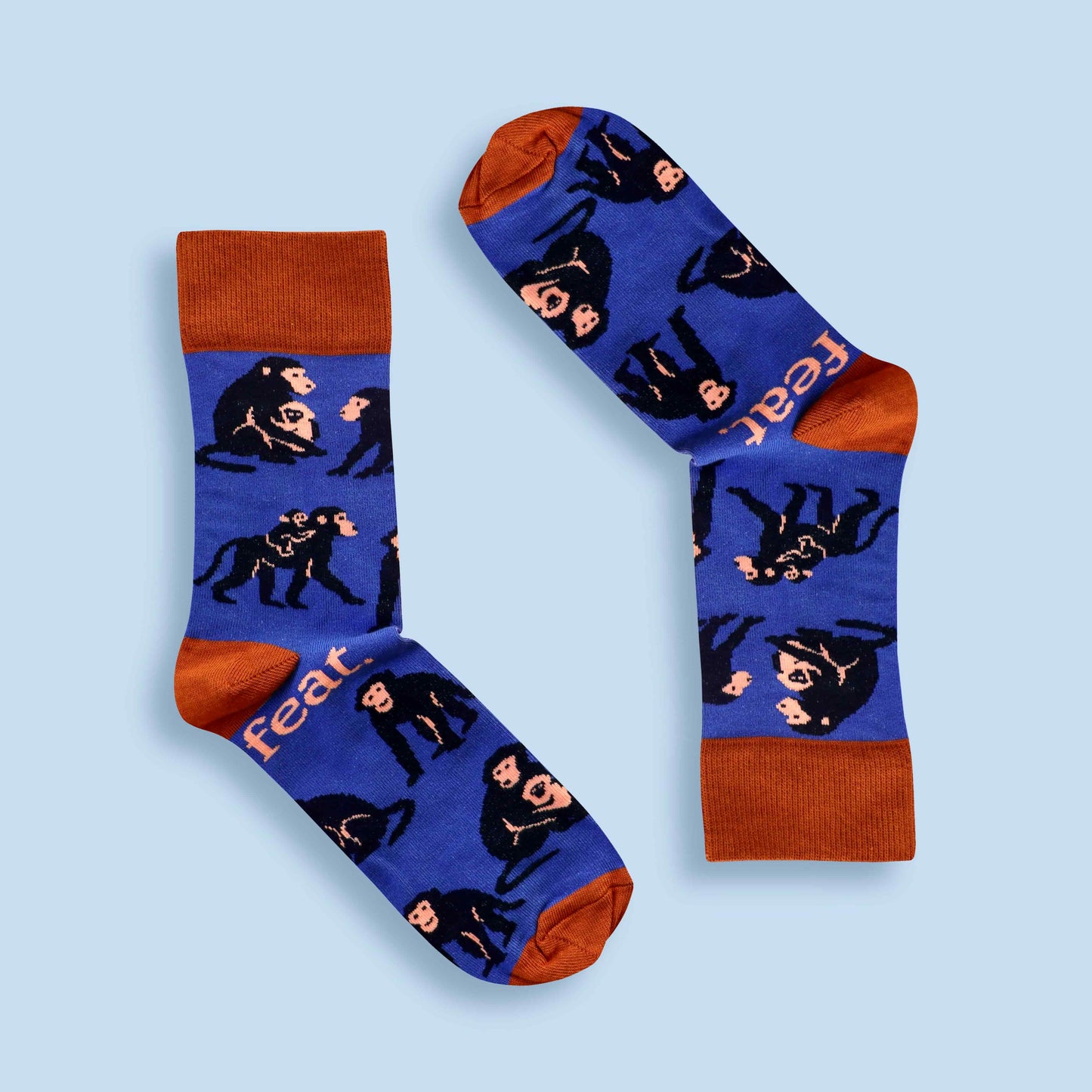 Baboon socks in blue and rust with blue background