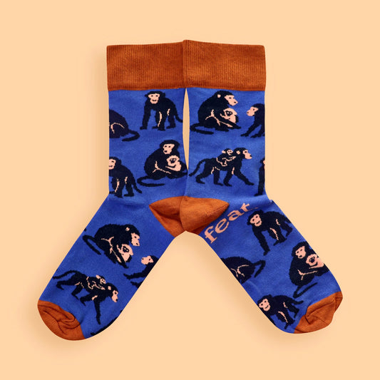 Blue and rust baboon socks on peach background