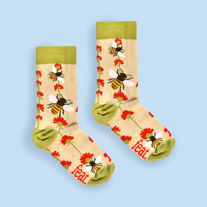 Bee and flower socks centre image blue background