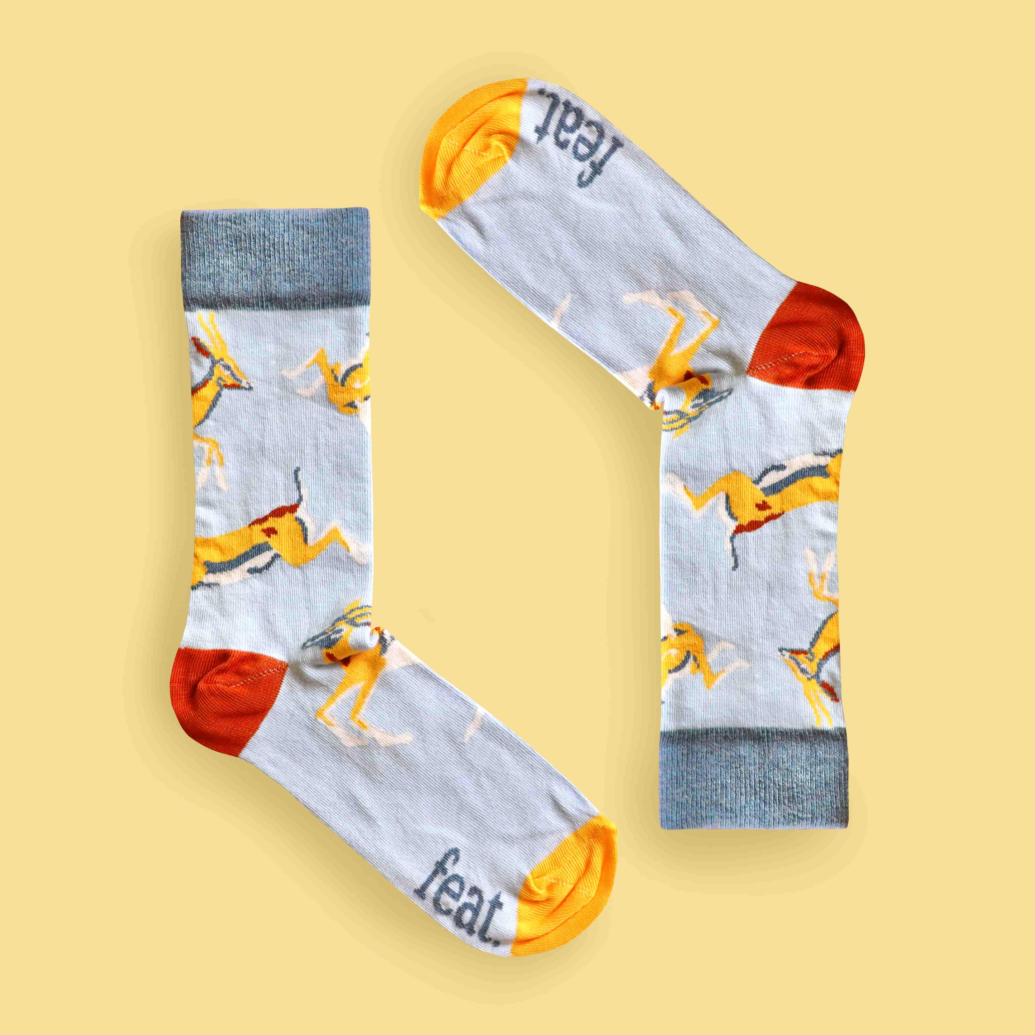 Blue springbok socks yellow background inverted