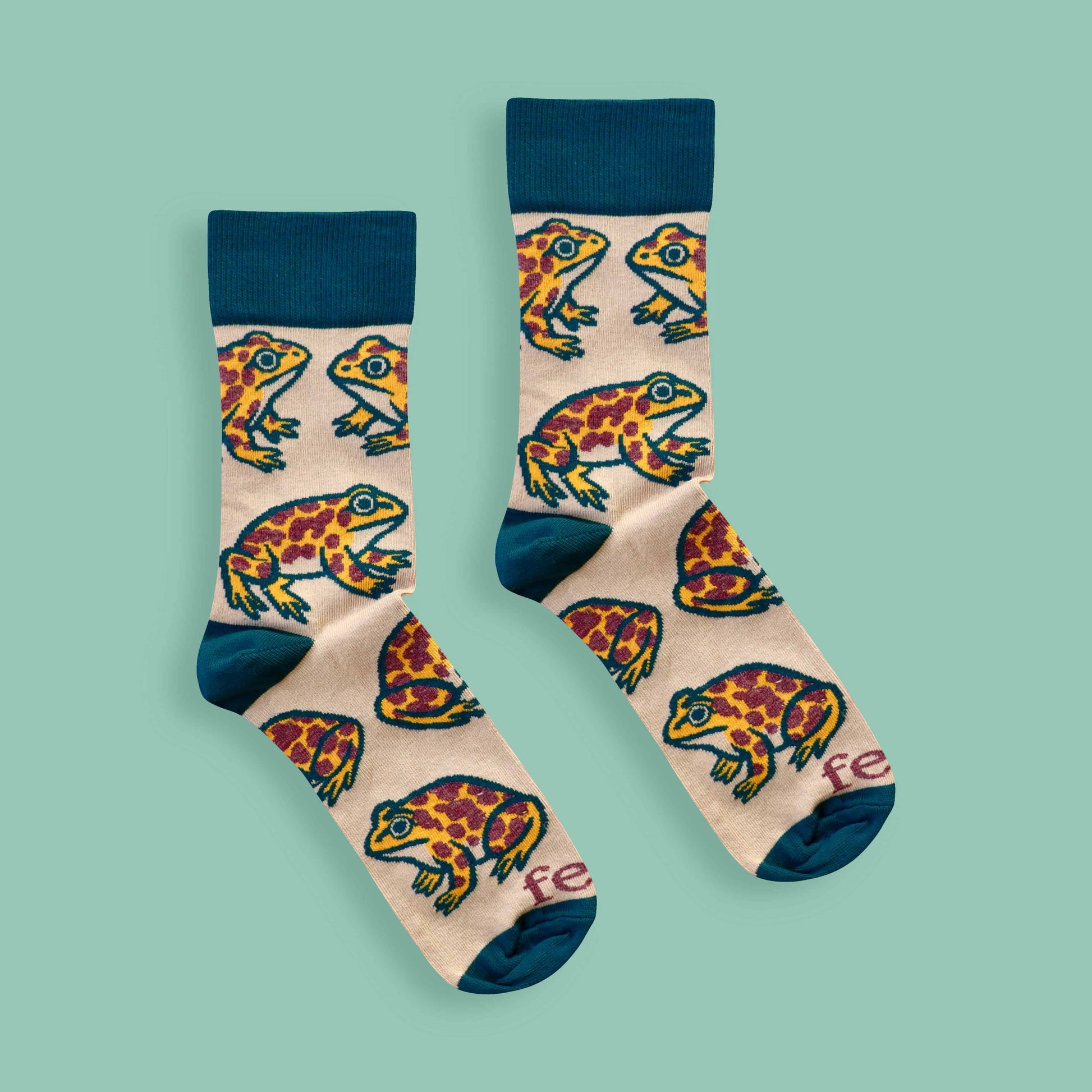 Cape leopard toad socks on green background