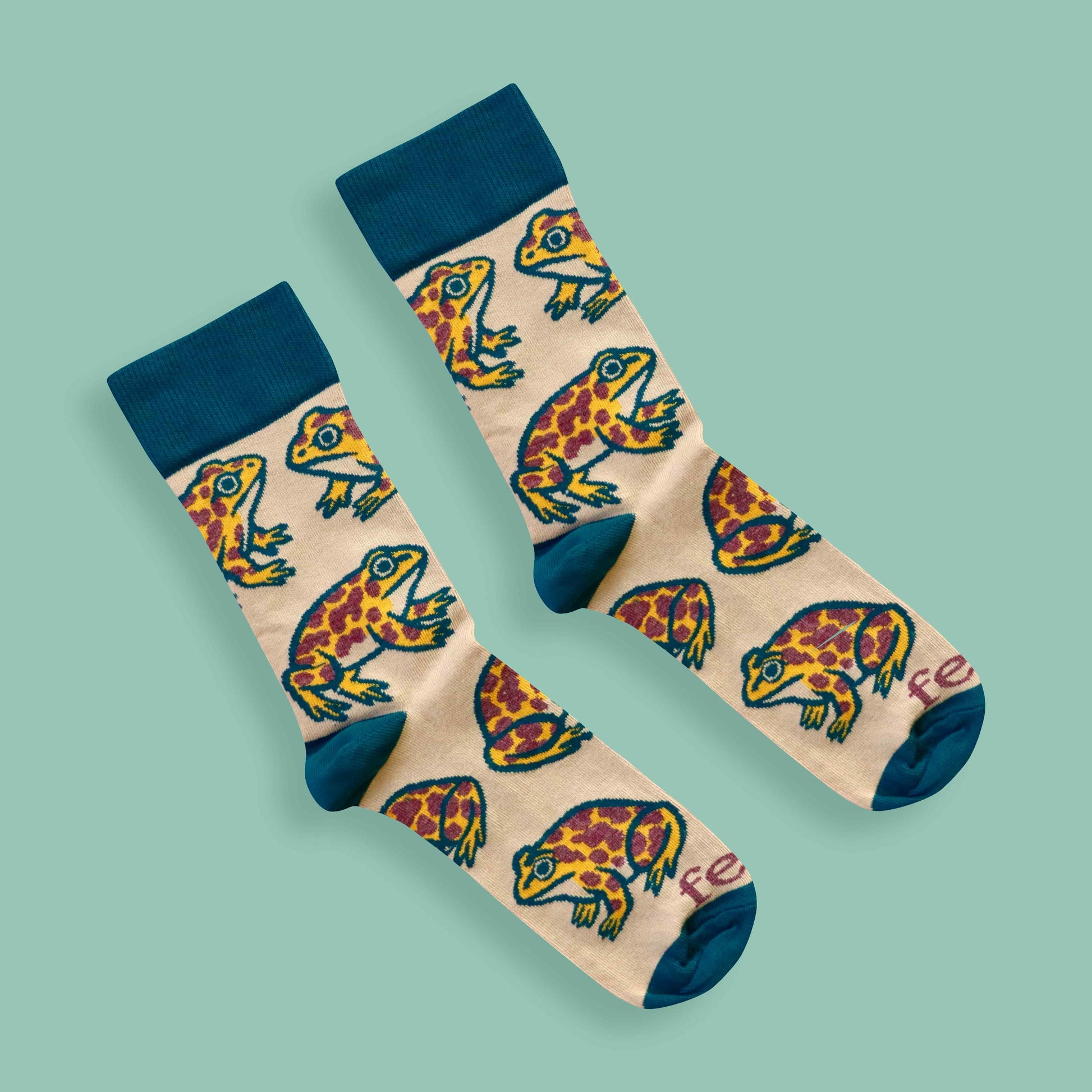 Cape leopard toad socks on green background