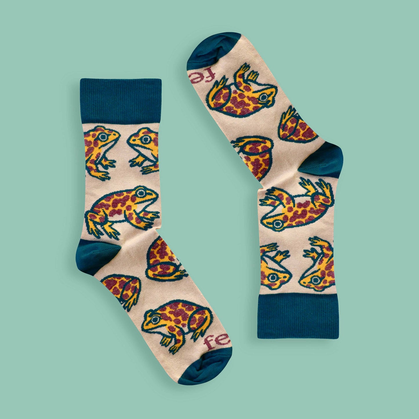 Cape leopard toad socks on green background