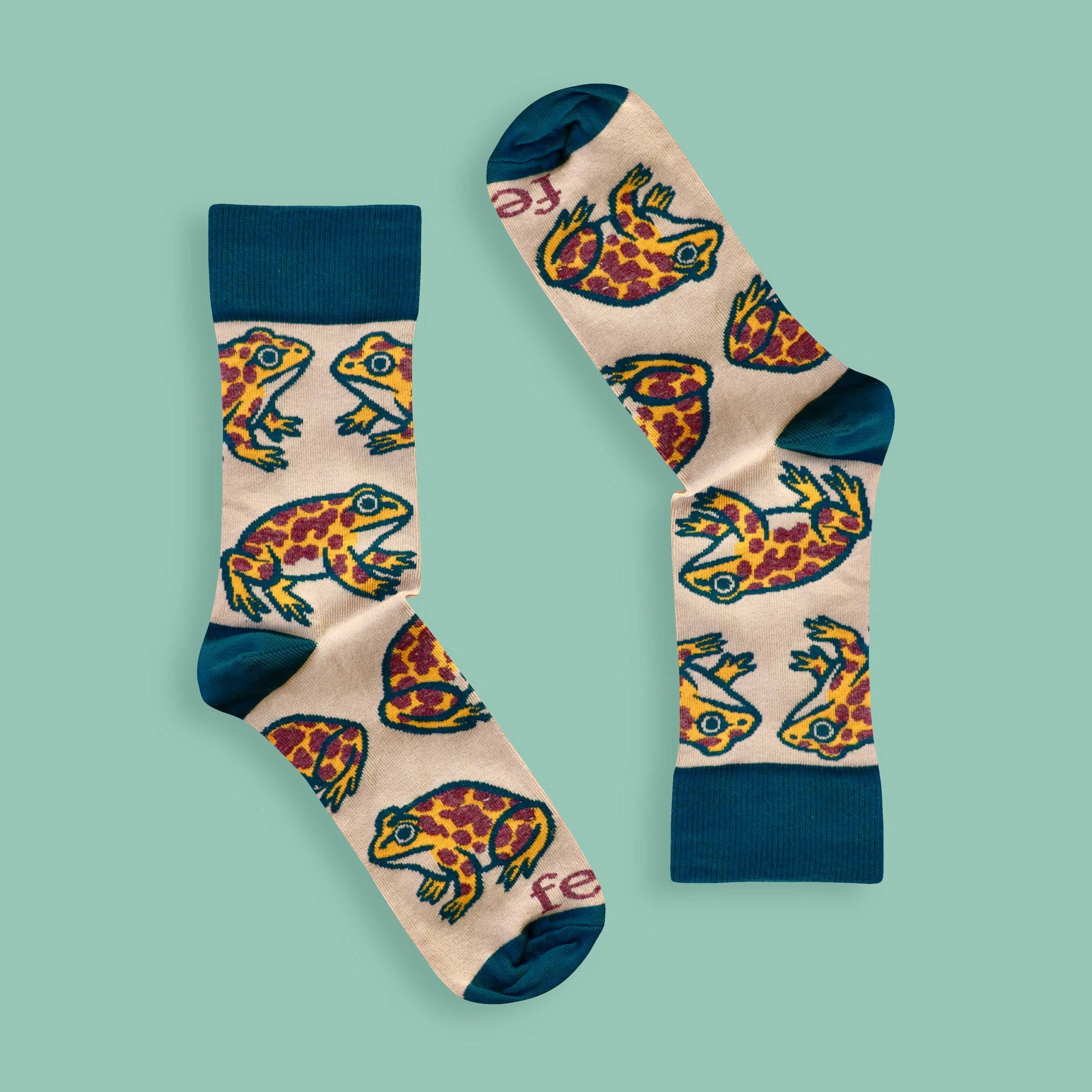 Cape leopard toad socks on green background