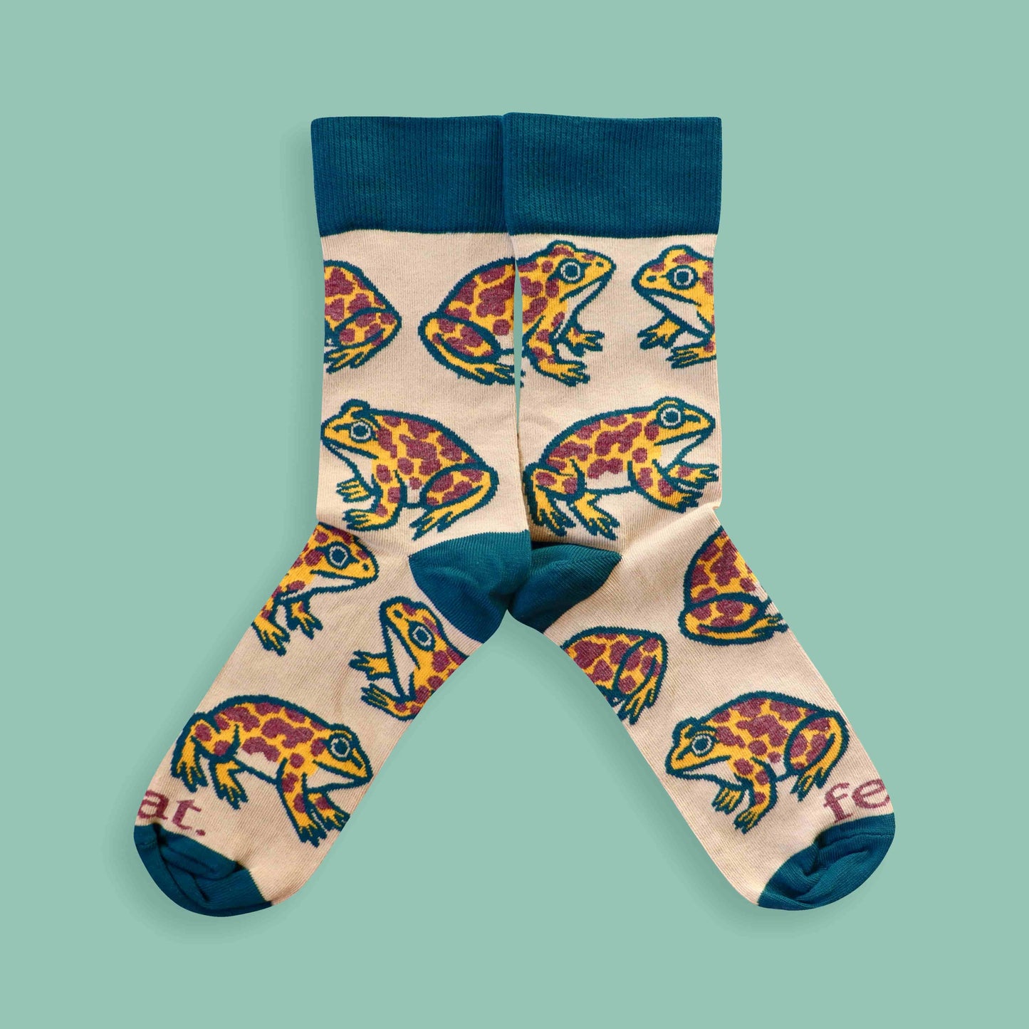 Cape leopard toad socks on green background