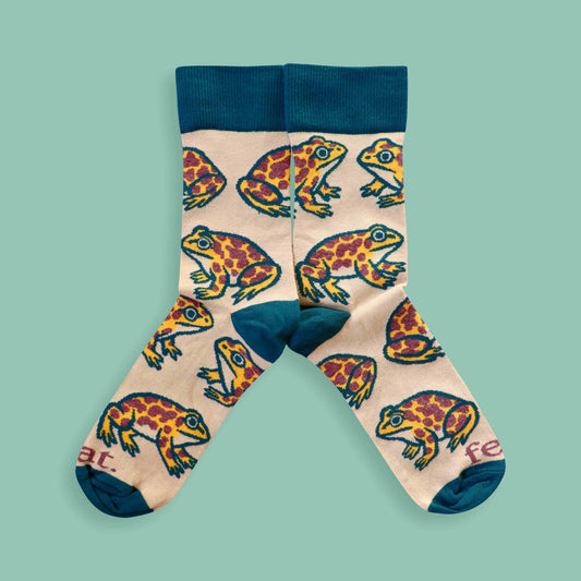 Cape leopard toad socks on green background
