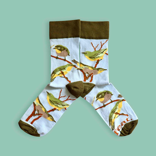 Cape white eye socks green background mirrored