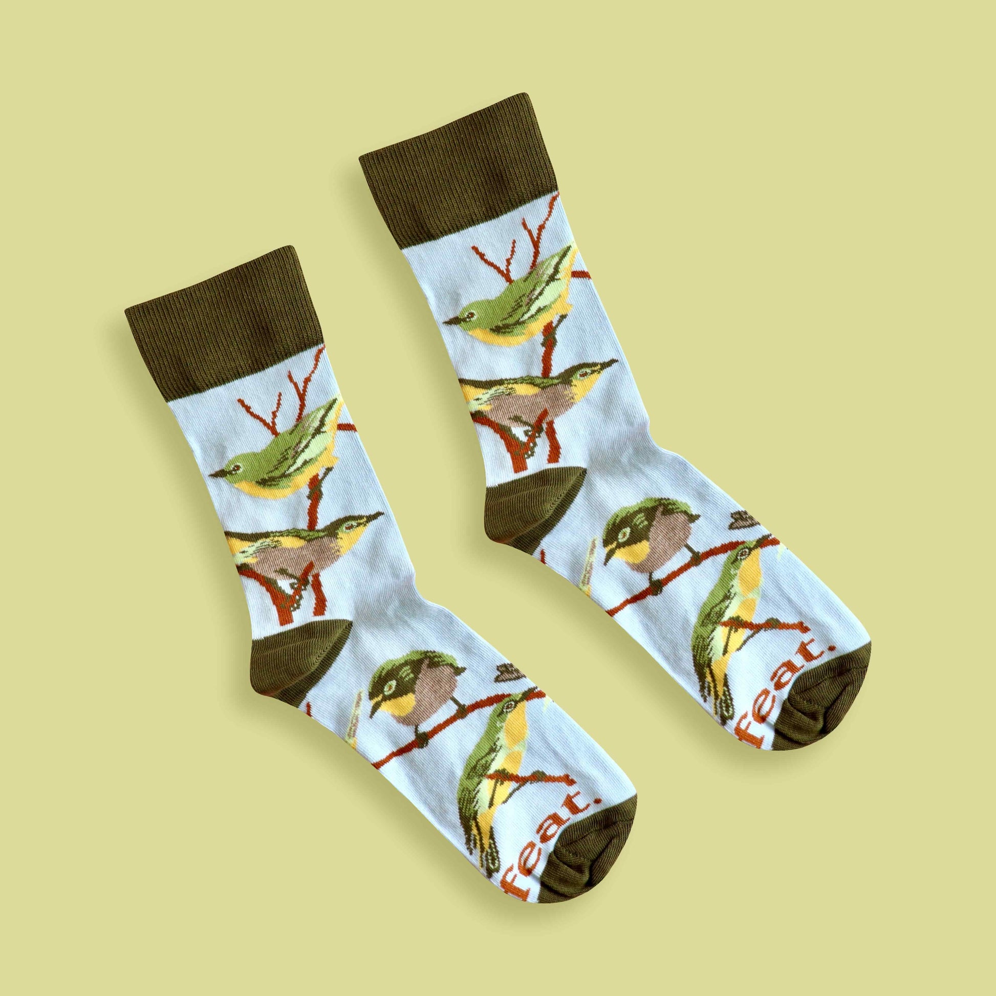 Cape white-eye socks lime background diagonal