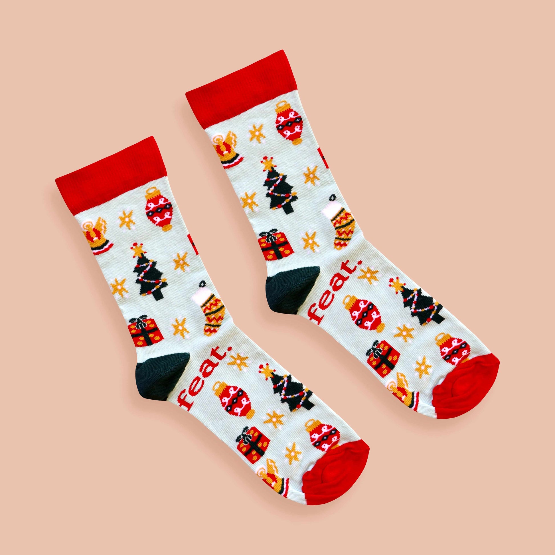 Christmas Cheer socks coral background diagonal