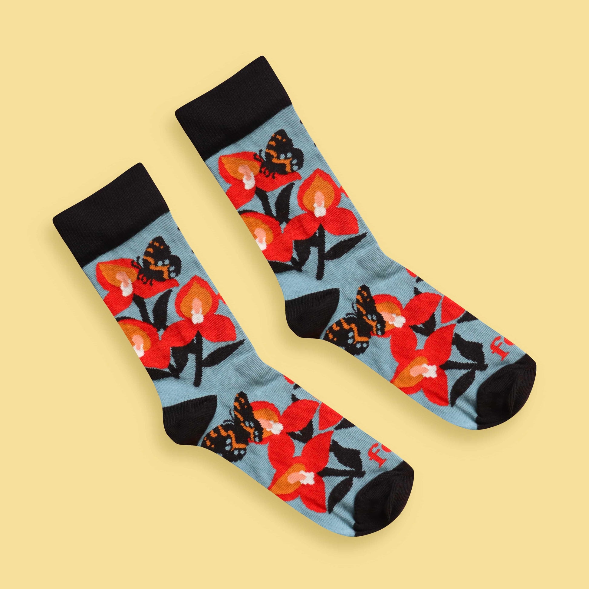Disa and butterfly socks yellow background diagonal