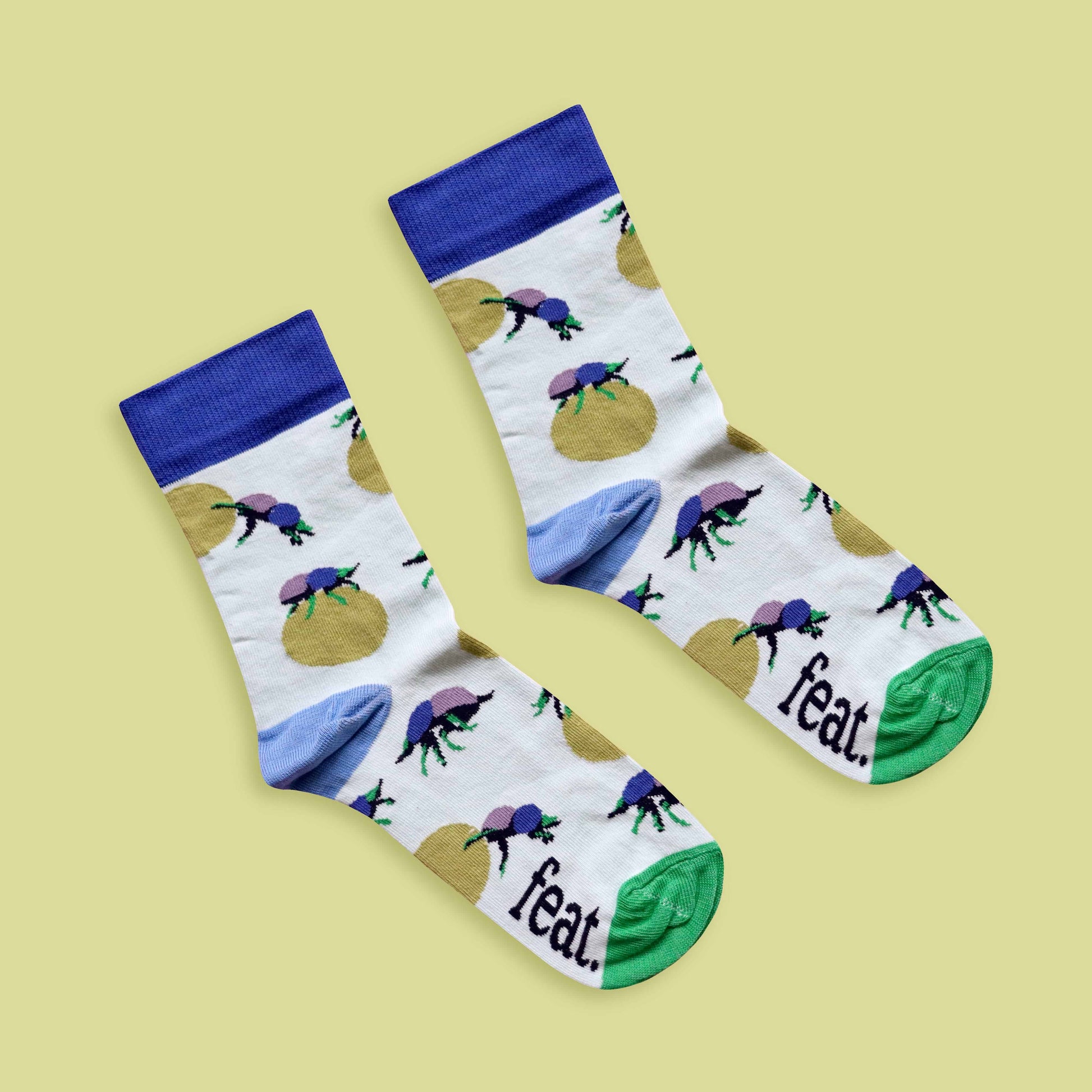 Dung beetle socks lime background diagonal