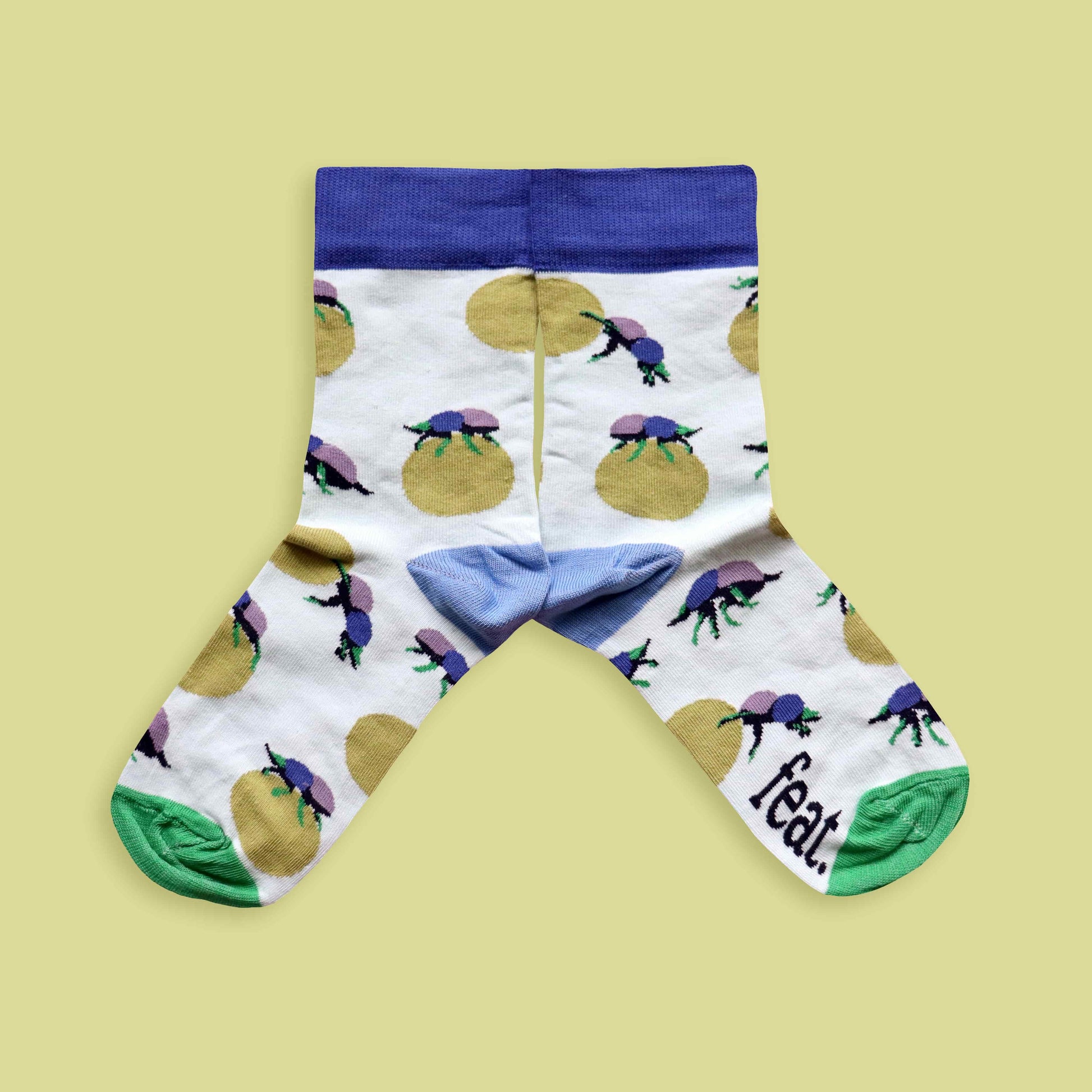 Dung beetle socks lime background mirrored