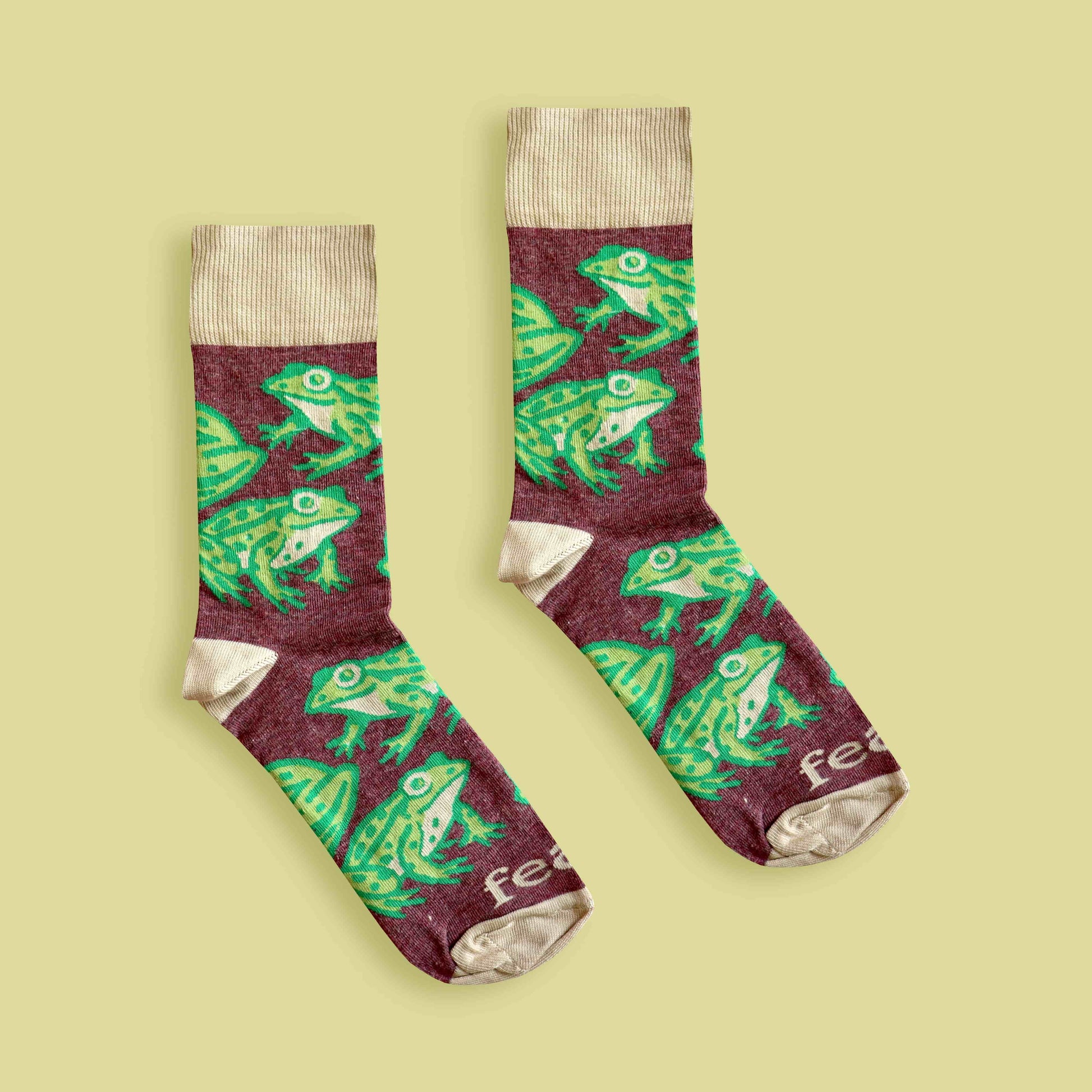 Cape river frog socks lime background centered