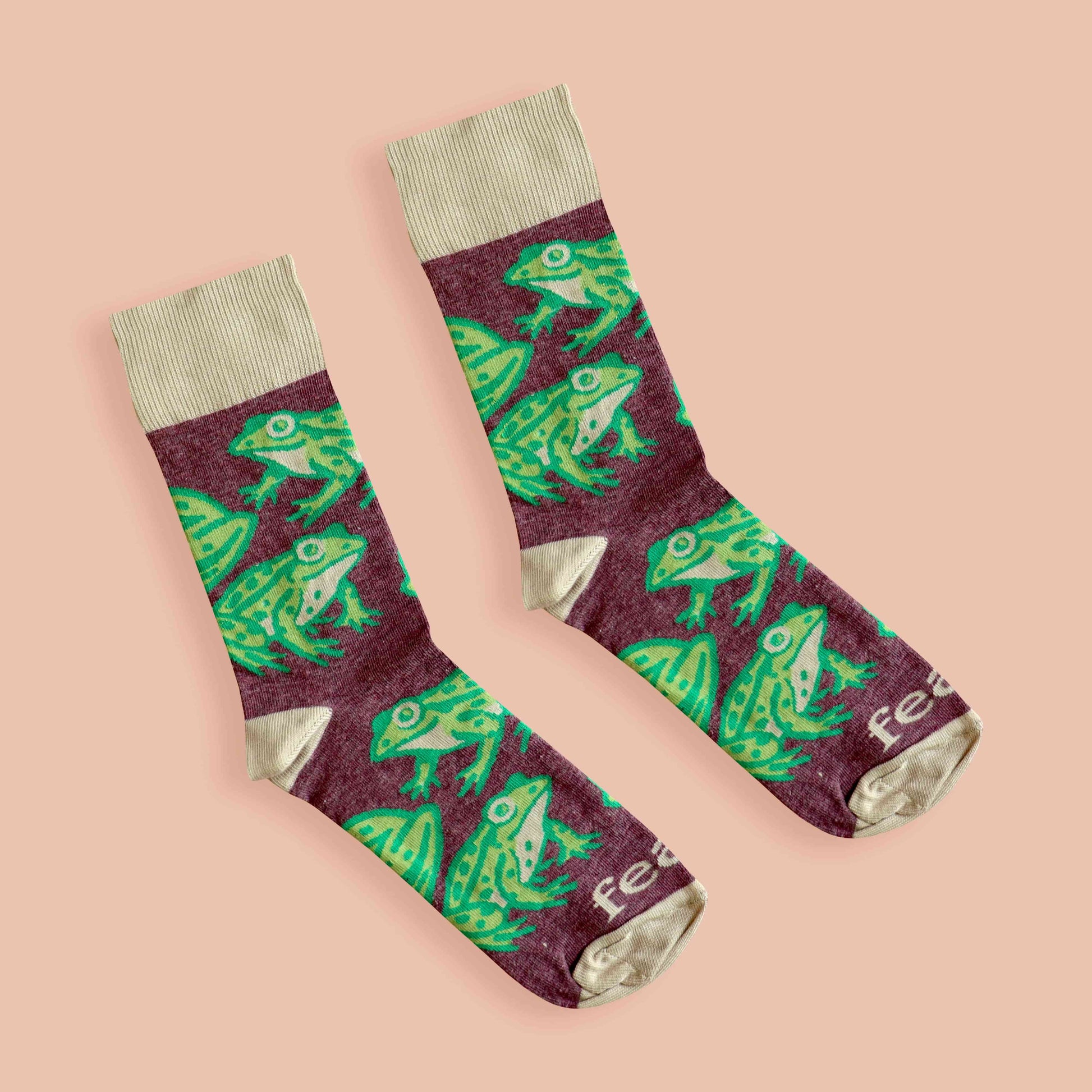 Cape river frog socks peach background diagonal