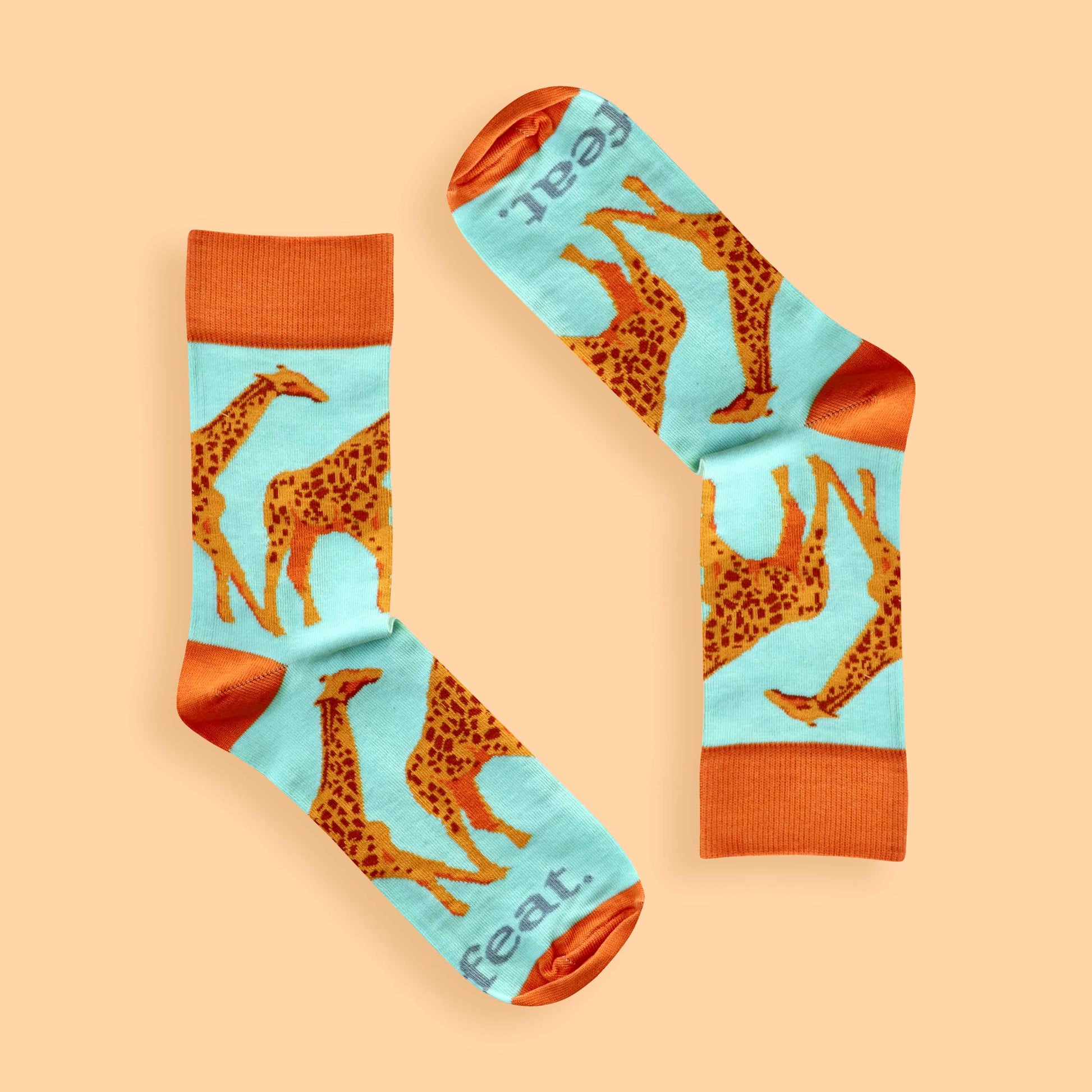 Giraffe socks for ladies on peach background