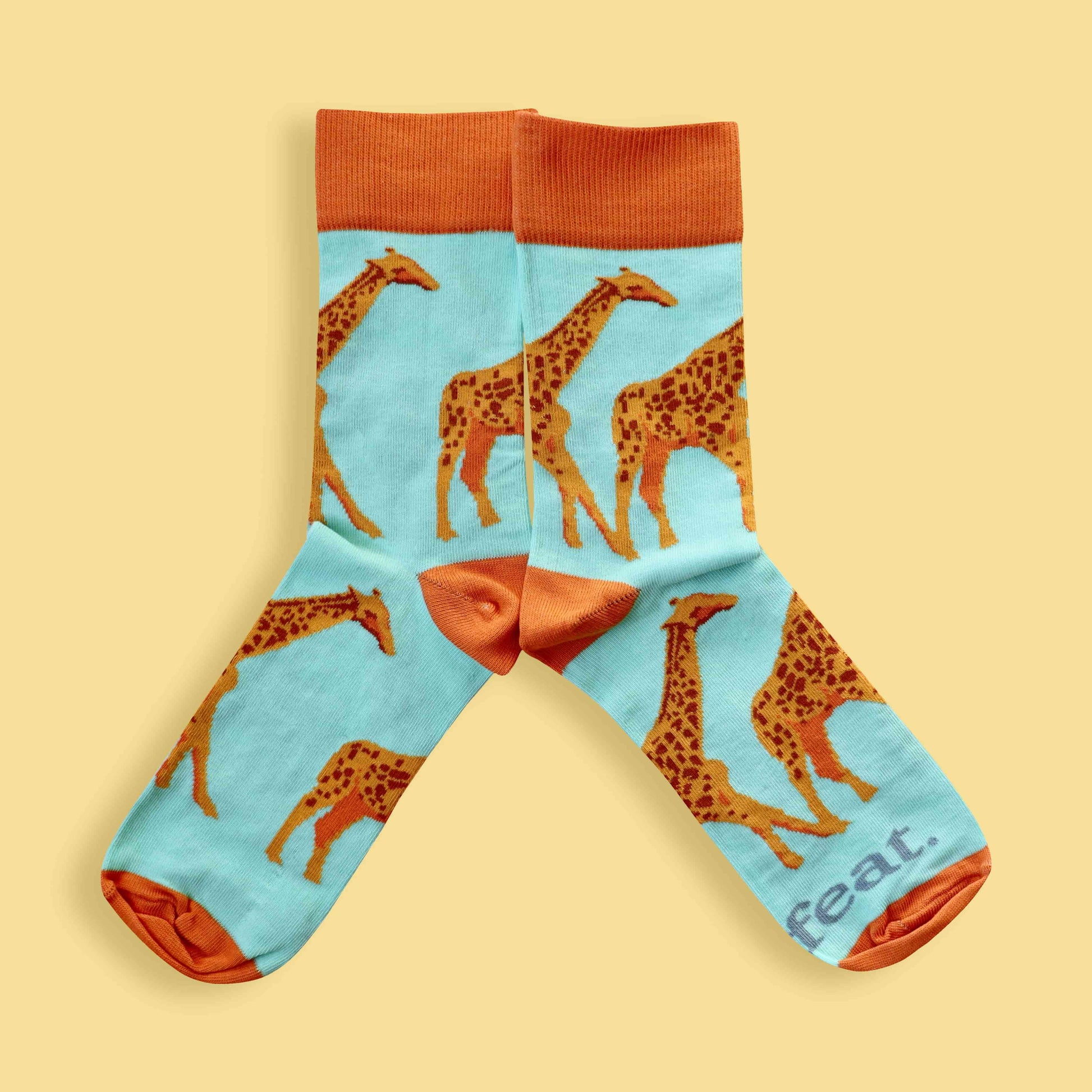 Men’s giraffe socks in green and orange