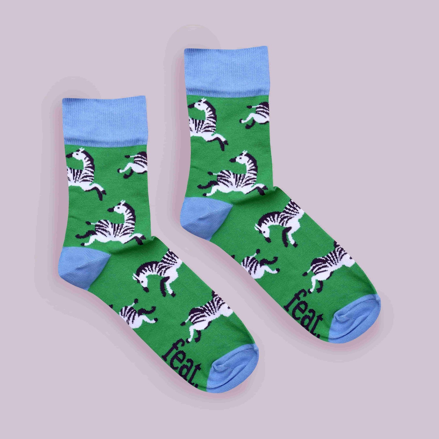 Green zebra socks lilac background centered layout