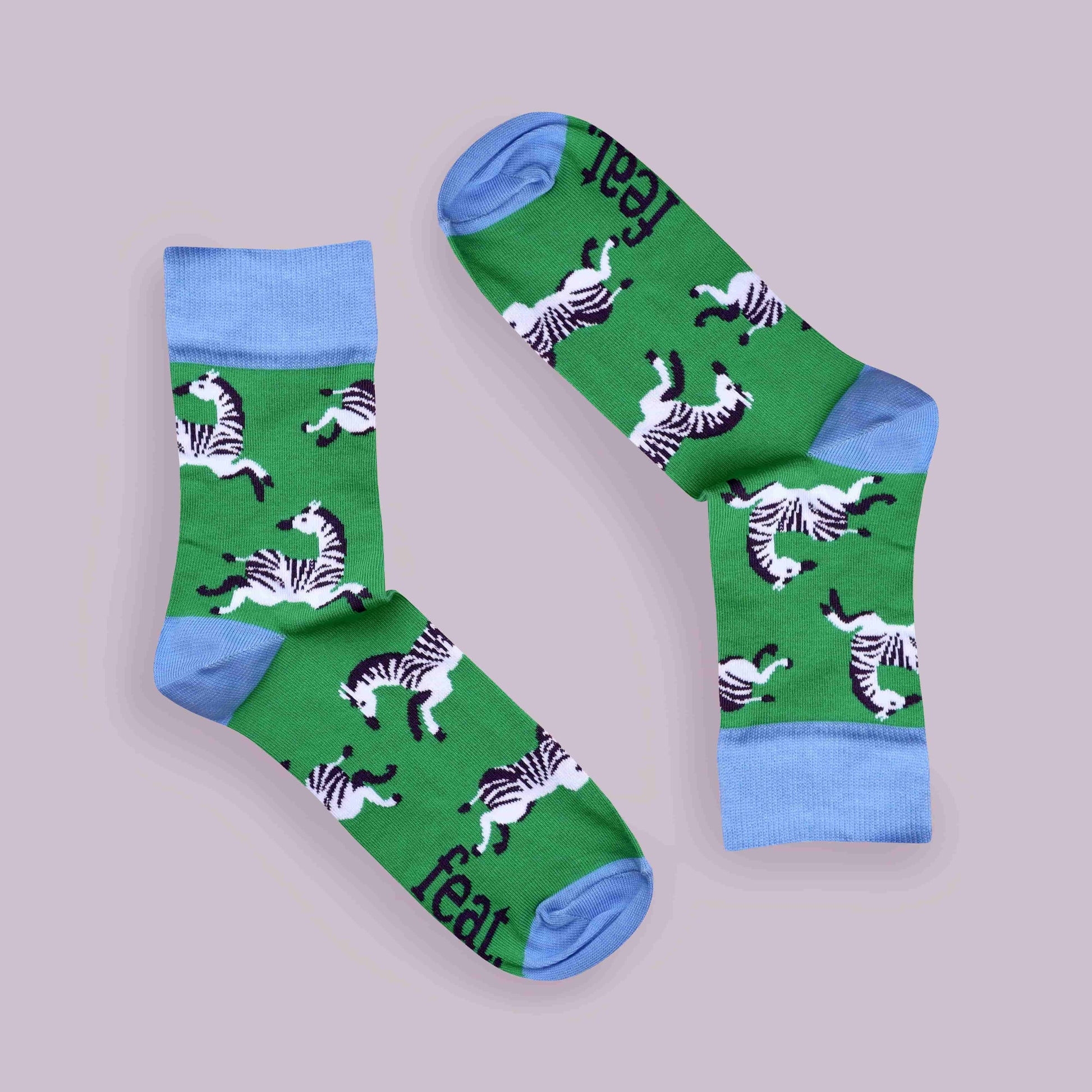 Green zebra socks lilac background inverted layout