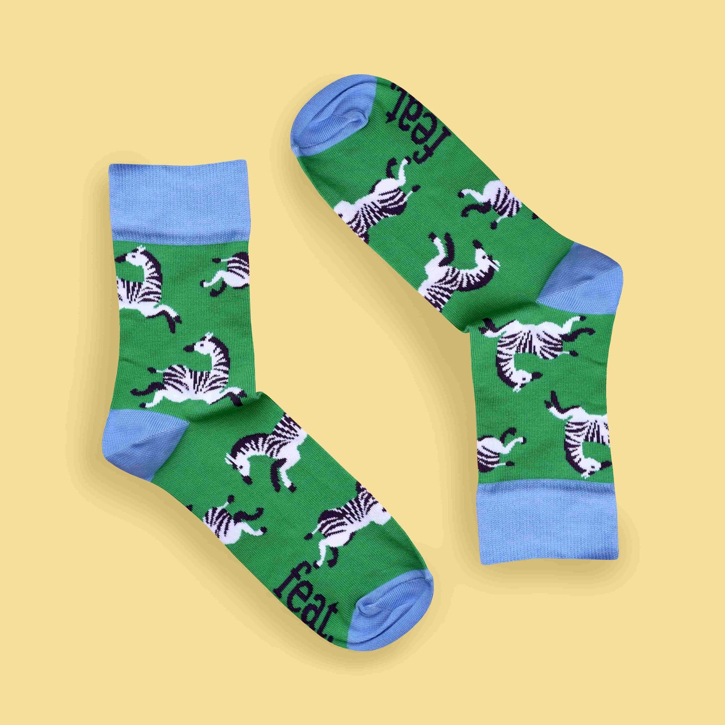 Green zebra socks yellow background inverted layout