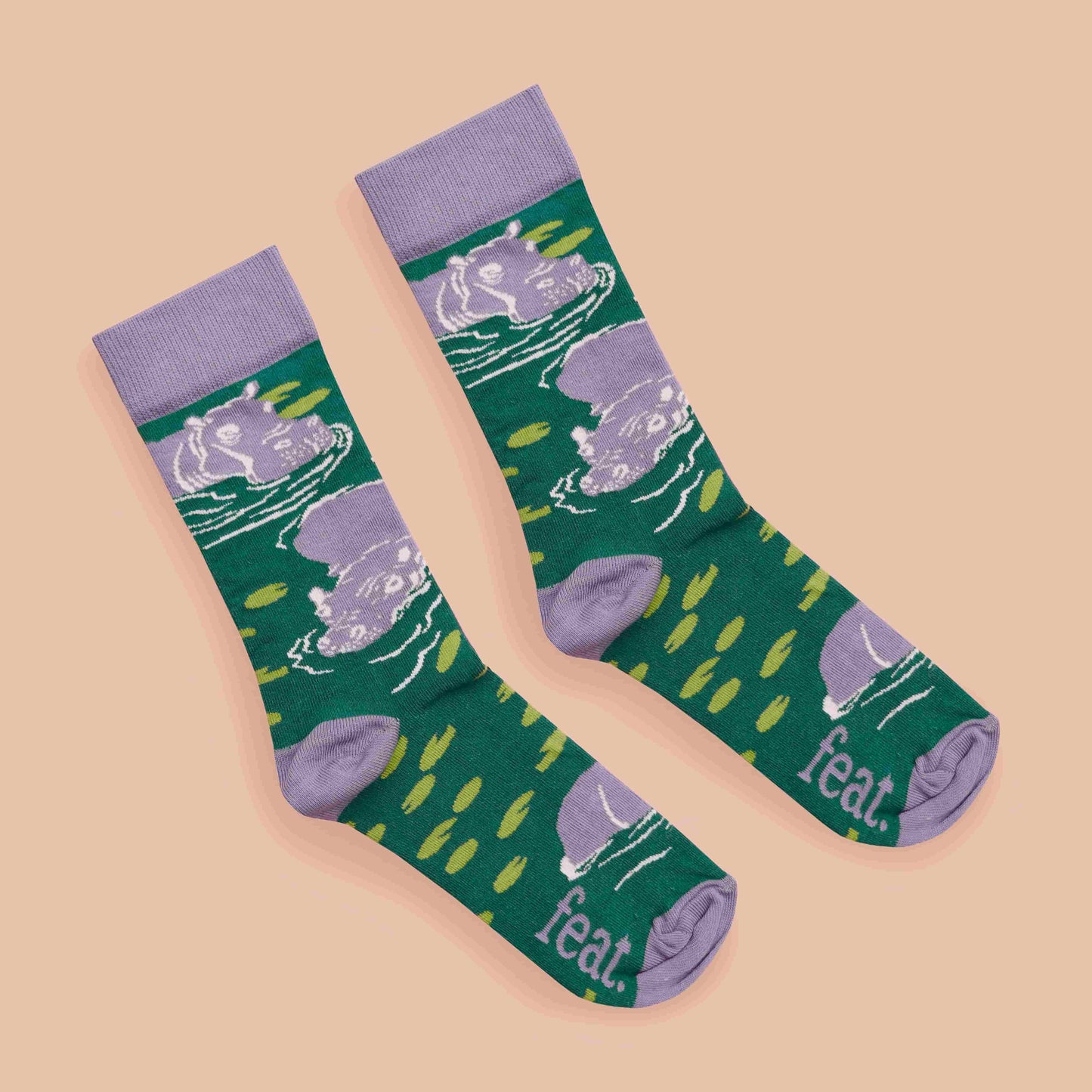 Hippo socks coral background diagonal layout