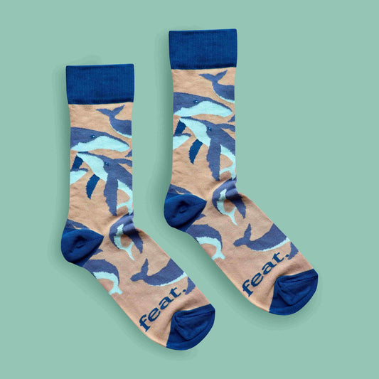 Humpback whale socks green background centered