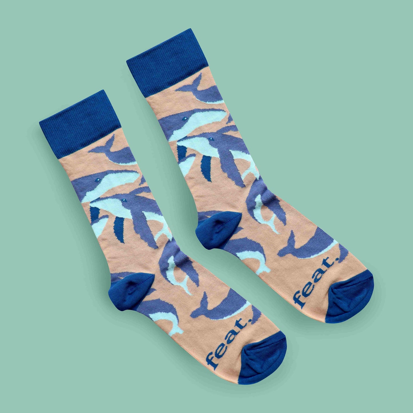 Humpback whale socks green background diagonal