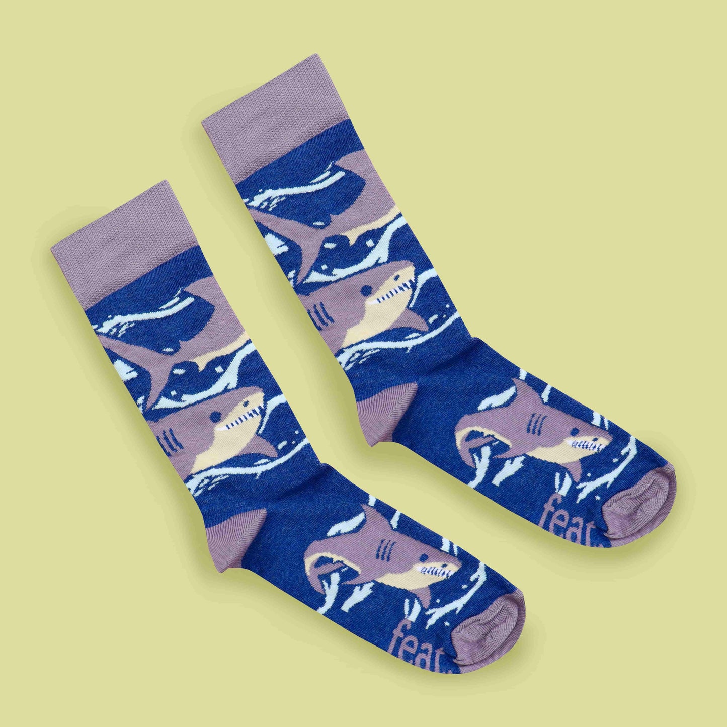 Purple shark socks lime background diagonal layout