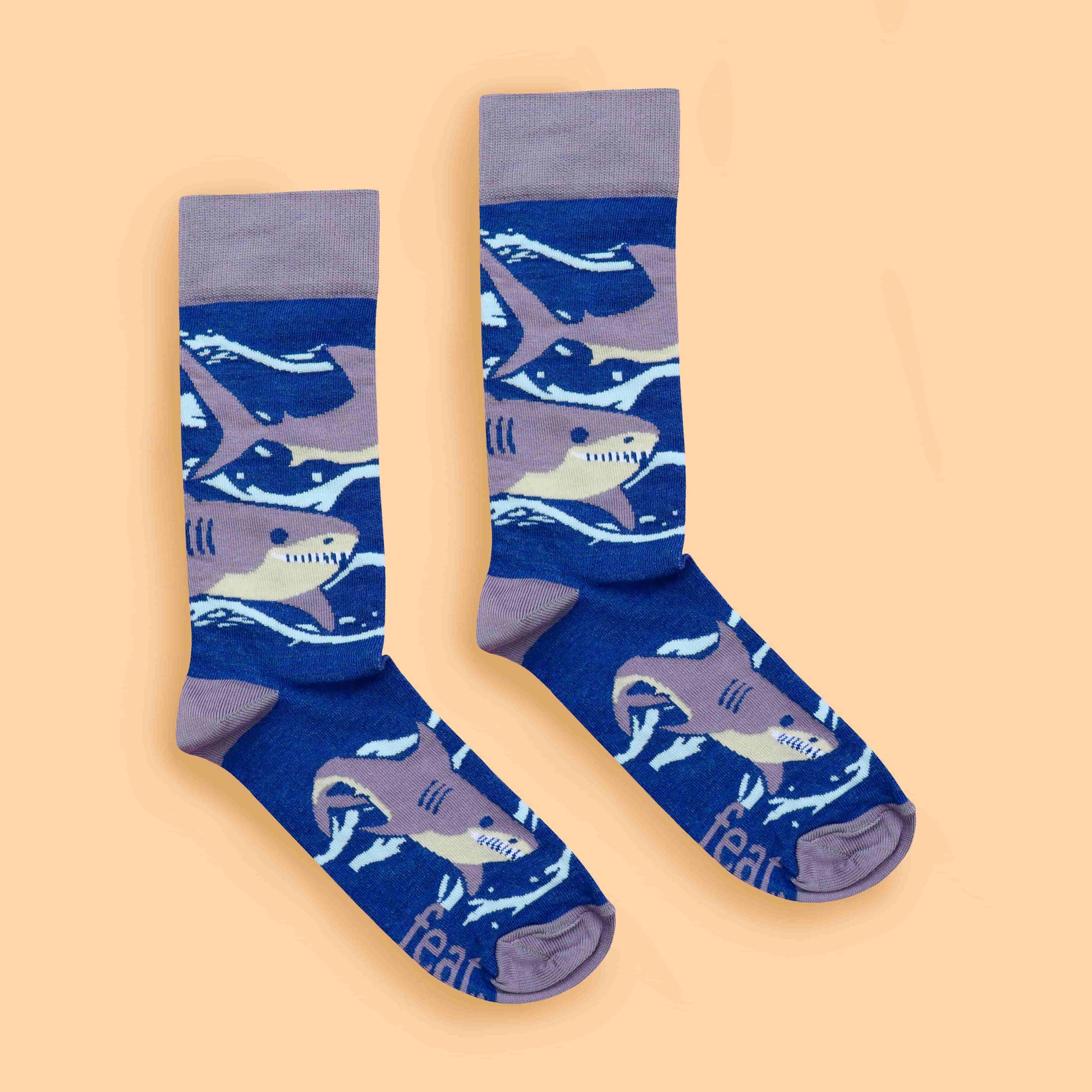 Purple shark socks peach background centered layout