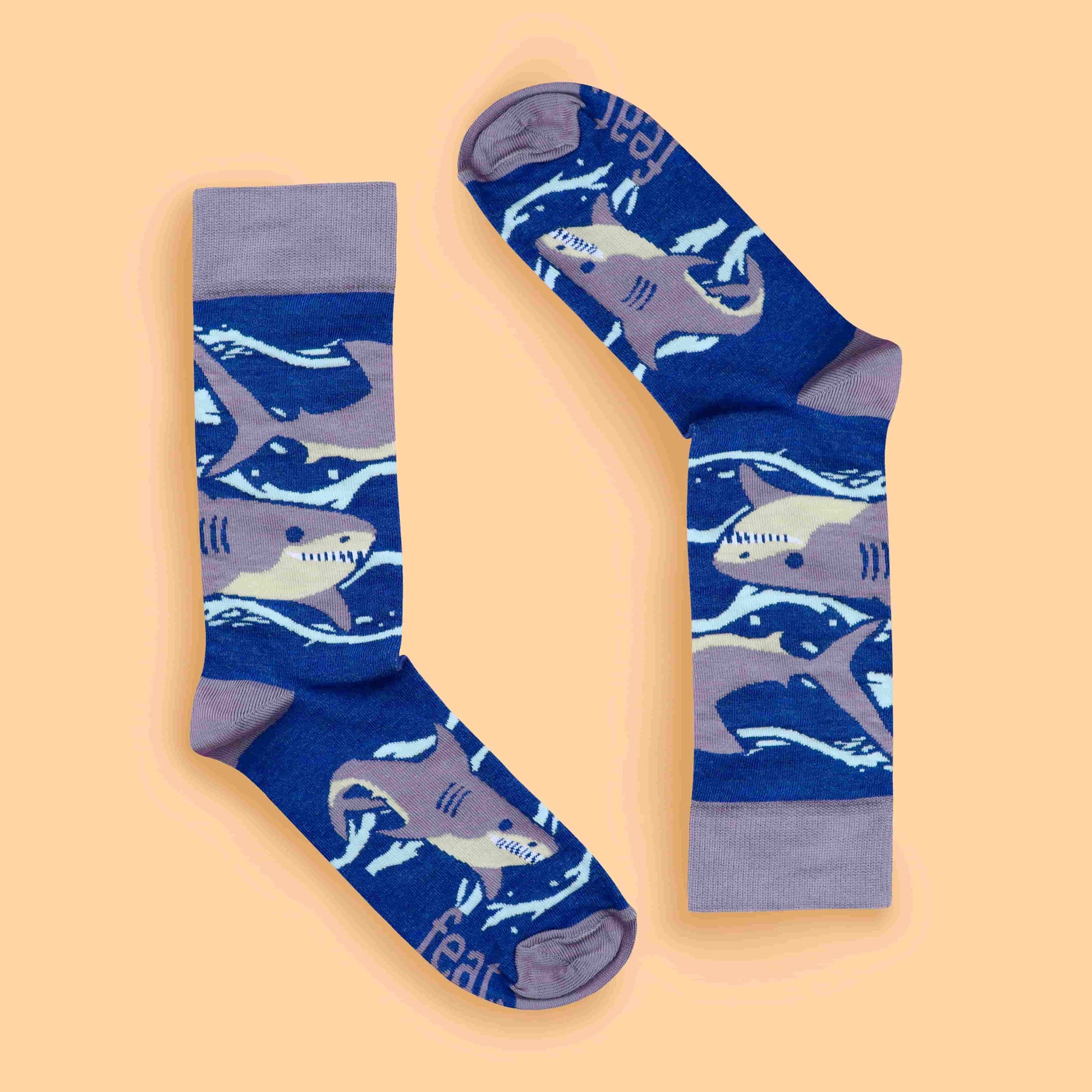 Purple shark socks peach background inverted layout