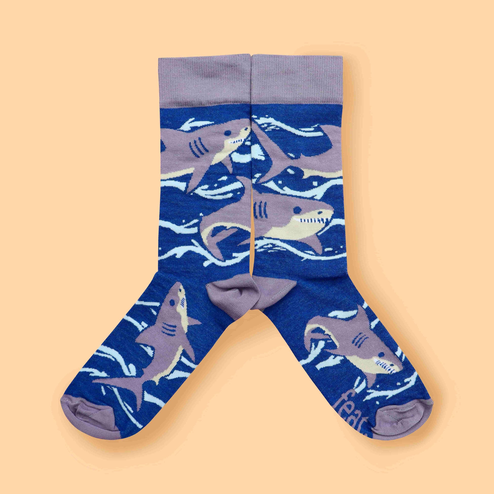 Purple shark socks peach background mirrored layout