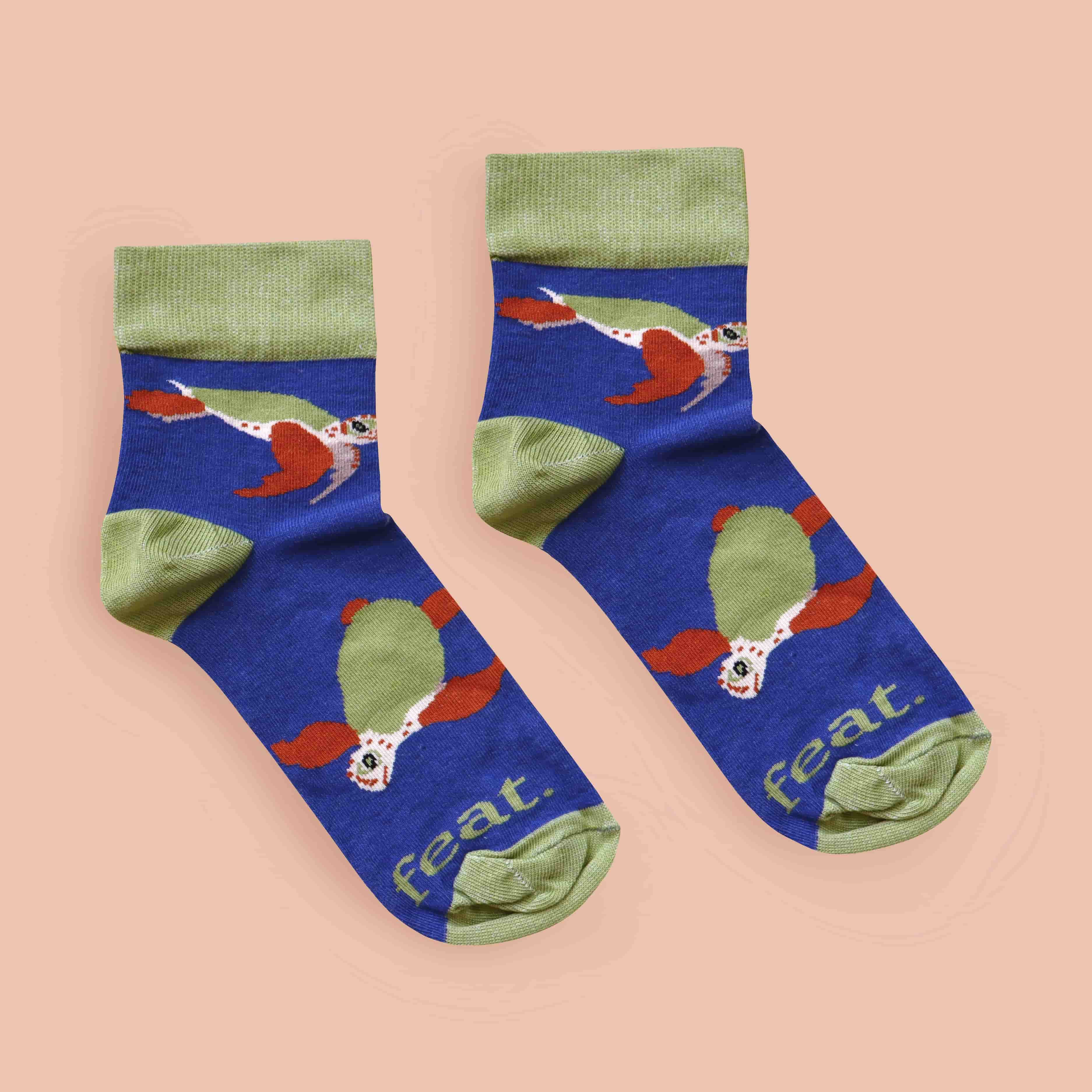 Loggerhead turtle socks with coral background front layout
