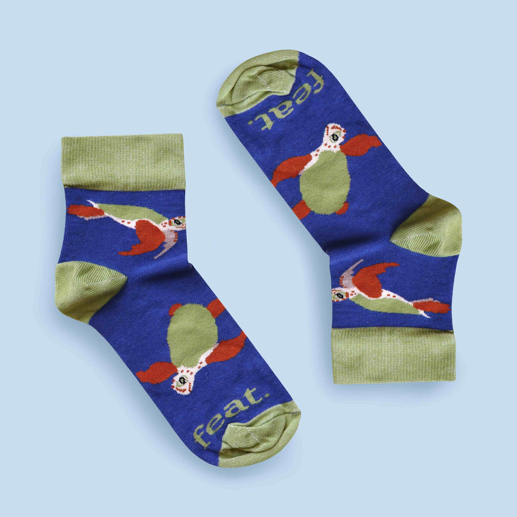 Loggerhead turtle socks with blue background mirrored layout