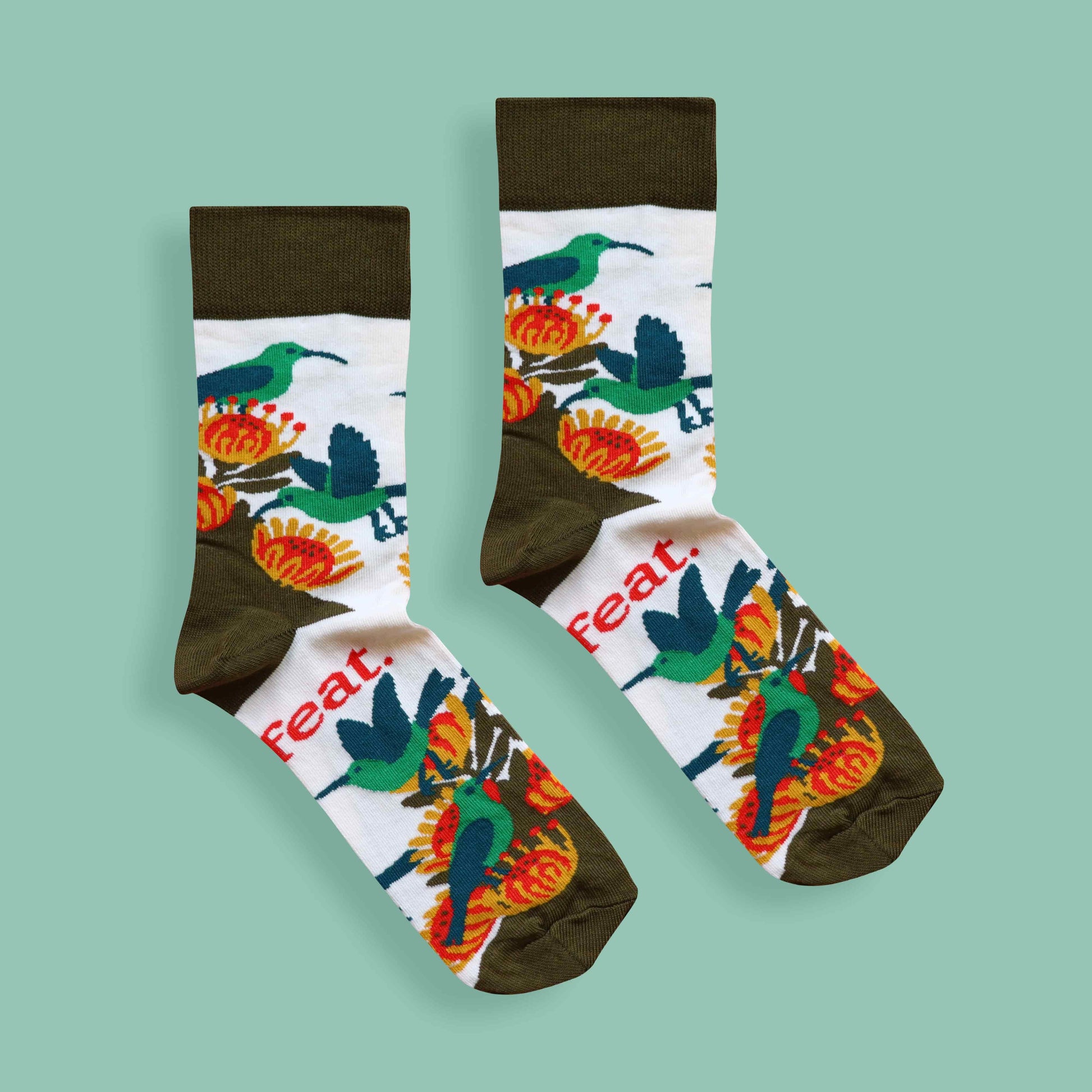 Ladies’ malachite sunbird socks green background centered
