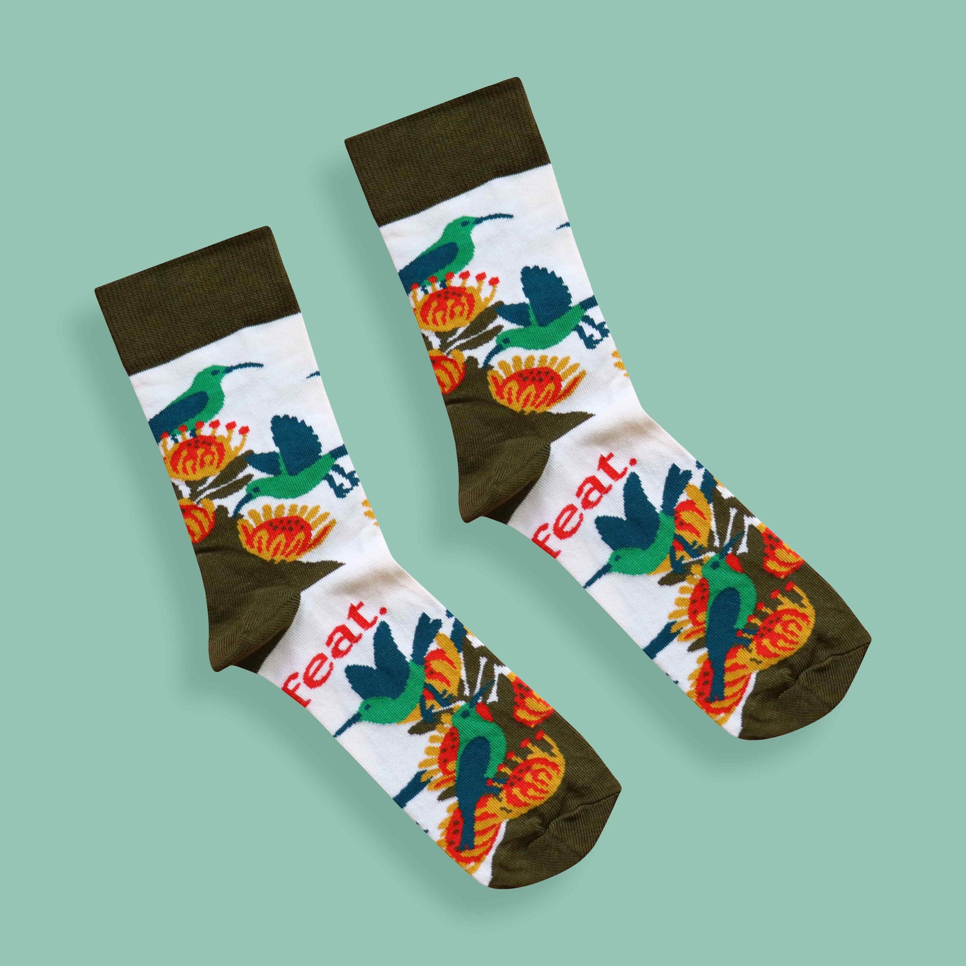 Ladies’ malachite sunbird socks green background diagonal