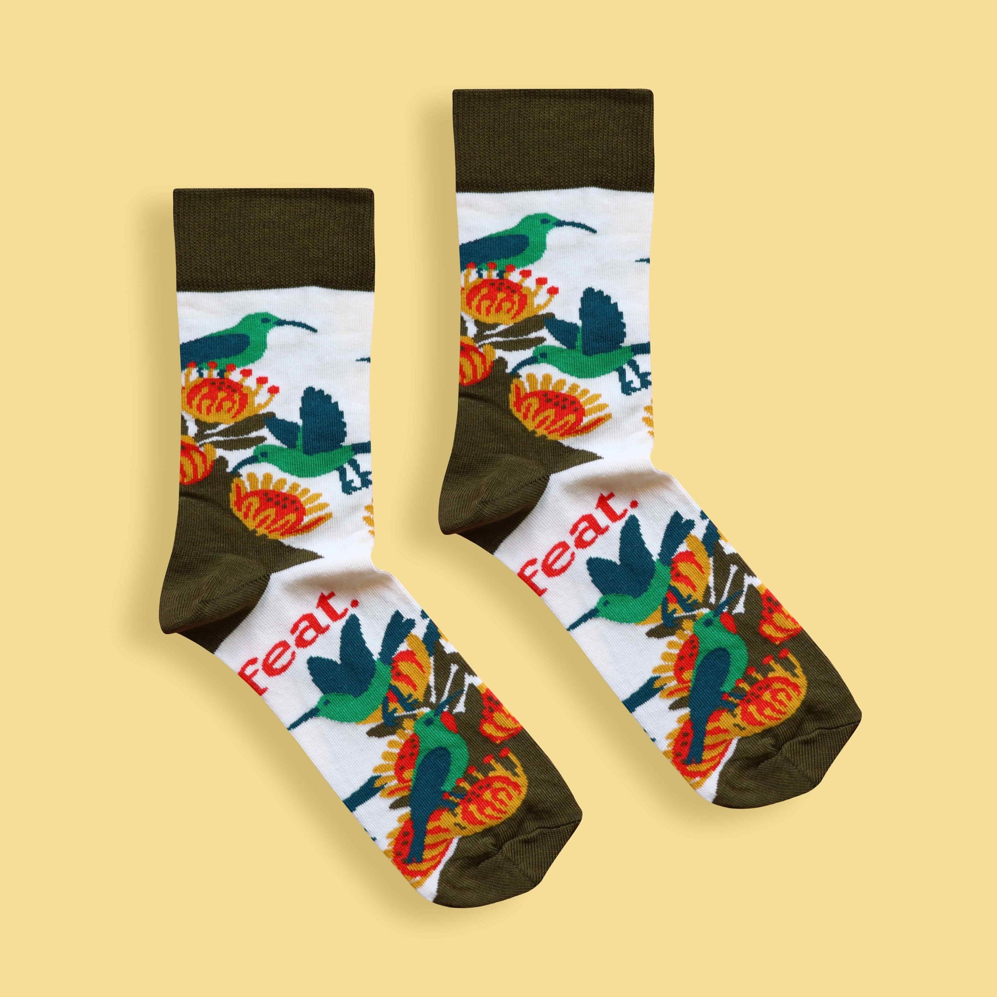 Men’s malachite sunbird socks yellow background centered