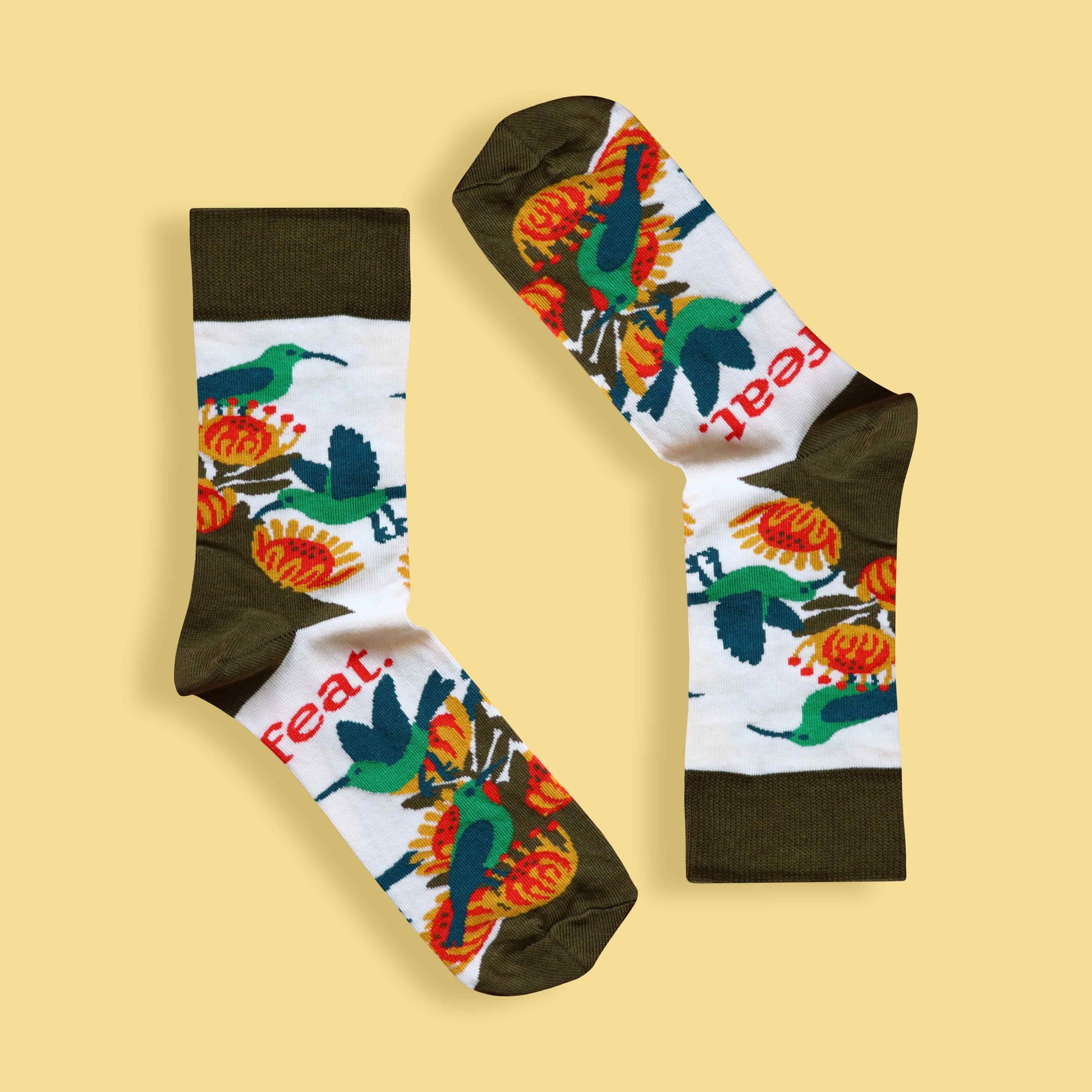 Men’s malachite sunbird socks yellow background inverted