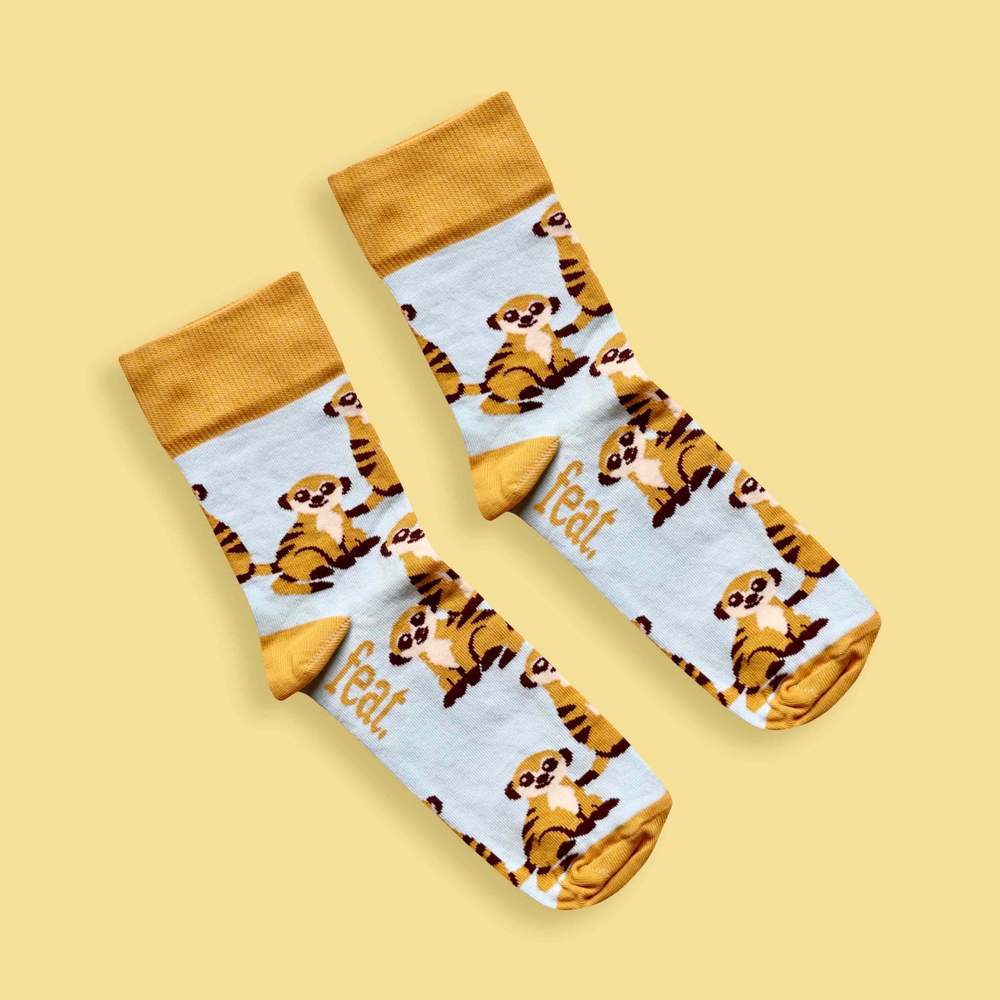 Meerkat socks yellow background diagonal
