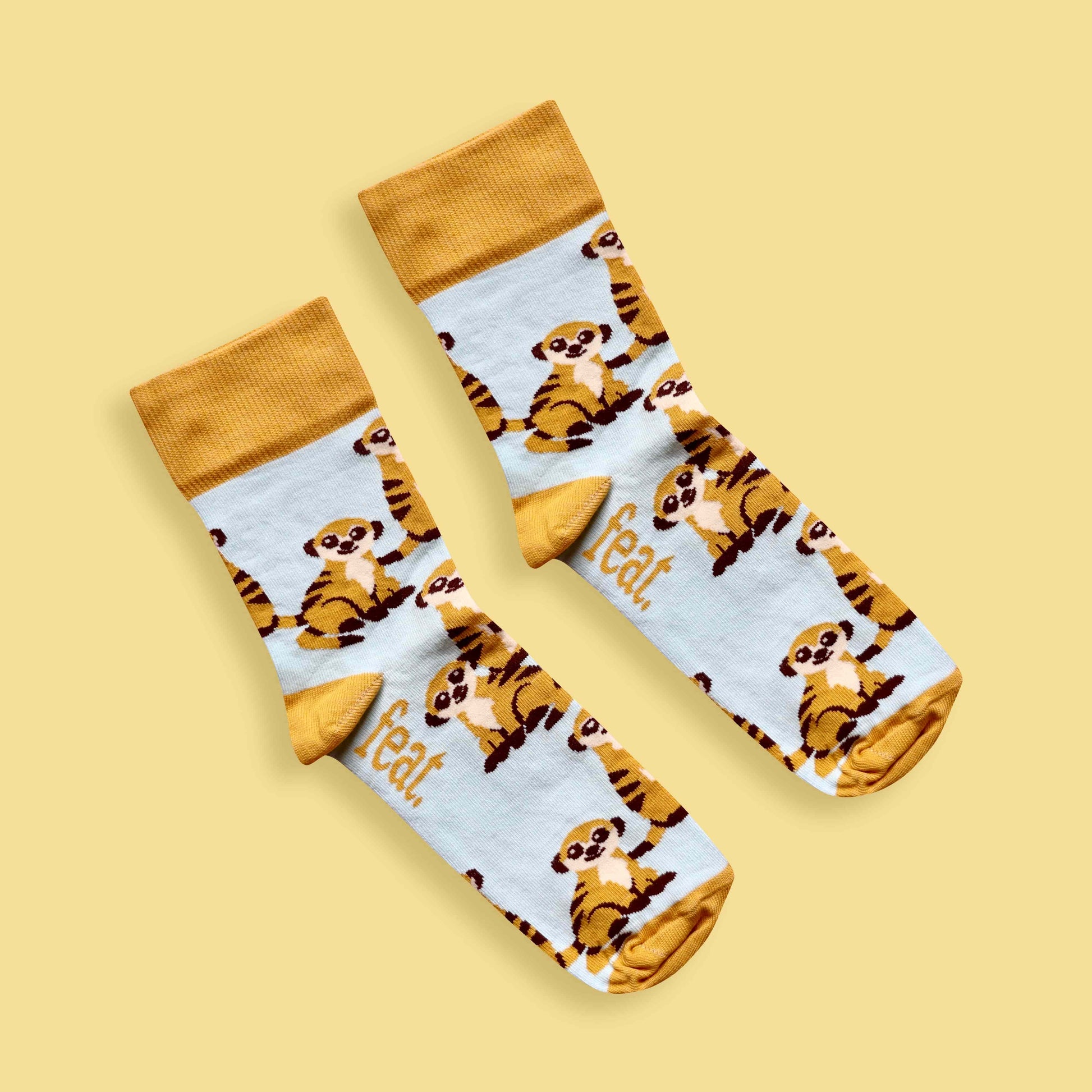 Meerkat socks yellow background diagonal