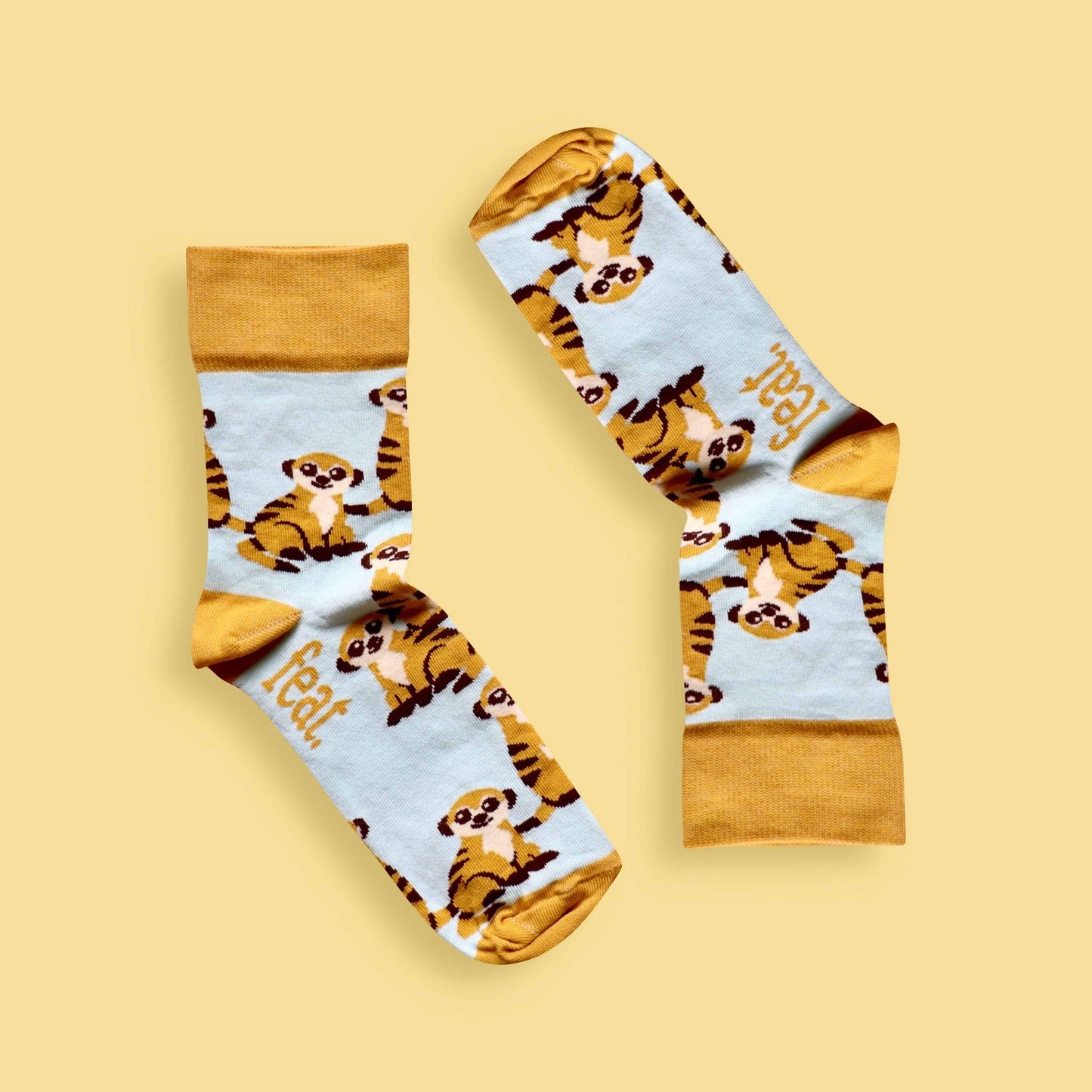 Meerkat socks yellow background inverted