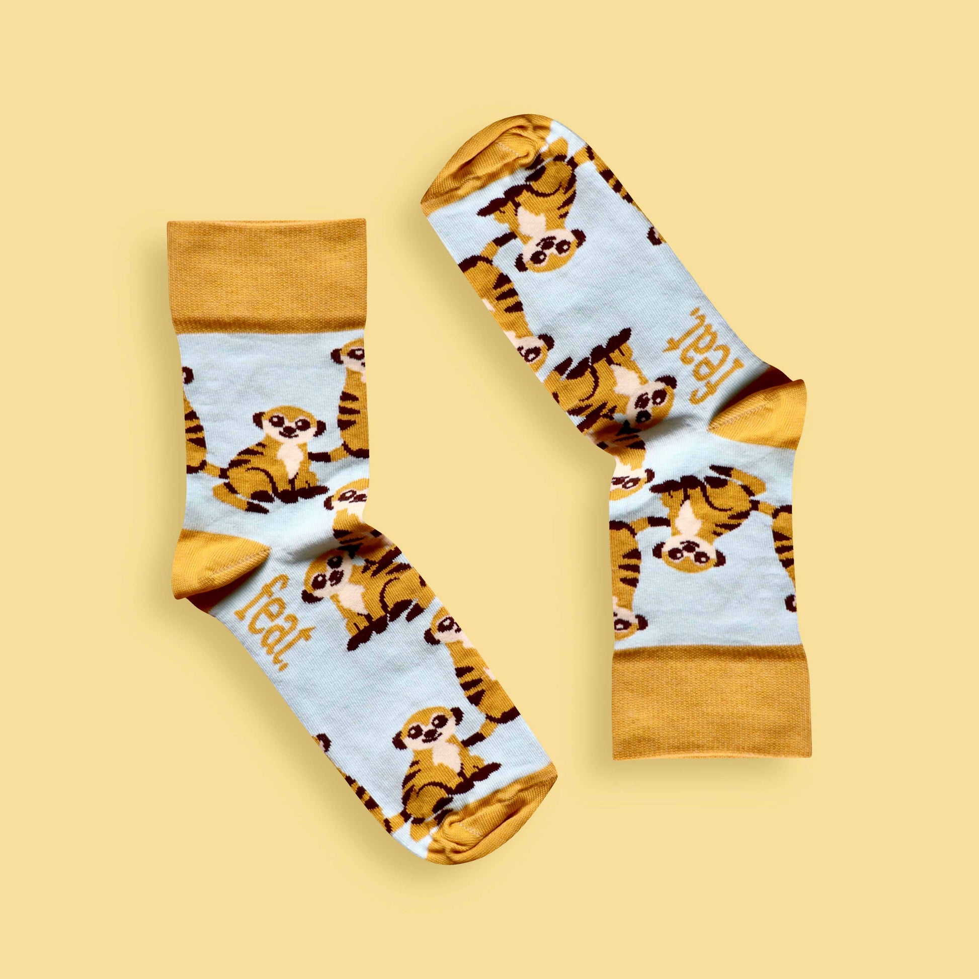 Meerkat socks yellow background inverted