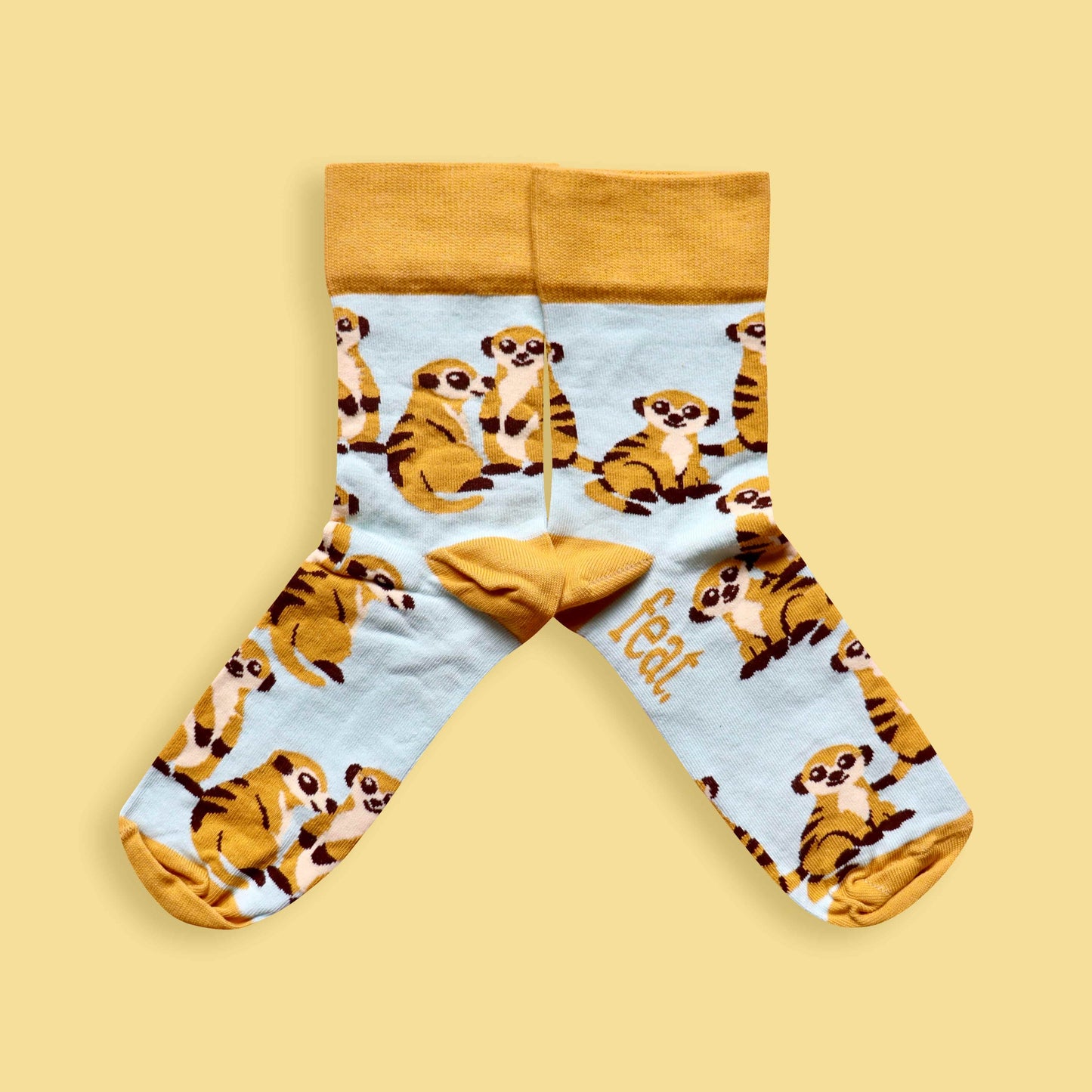 Meerkat socks yellow background mirrored
