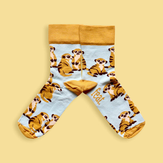 Meerkat socks yellow background mirrored