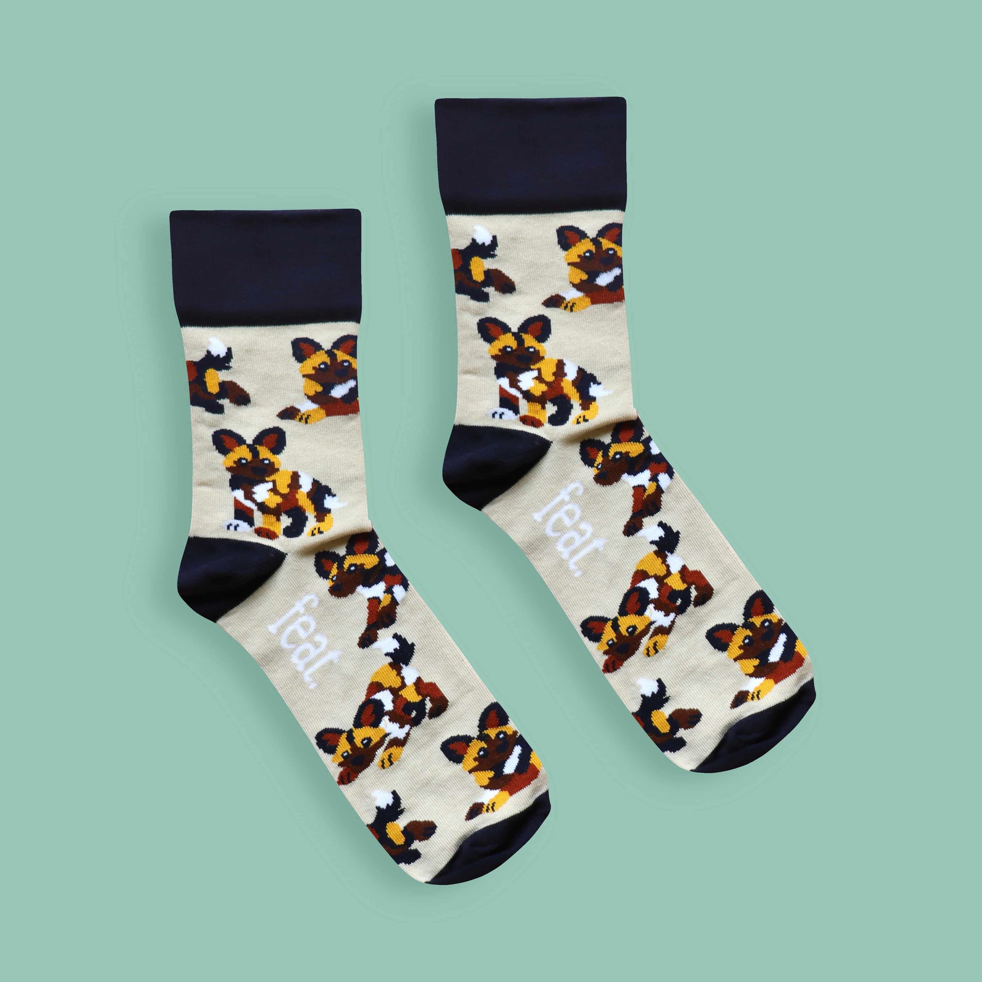 Painted dog socks green background centered
