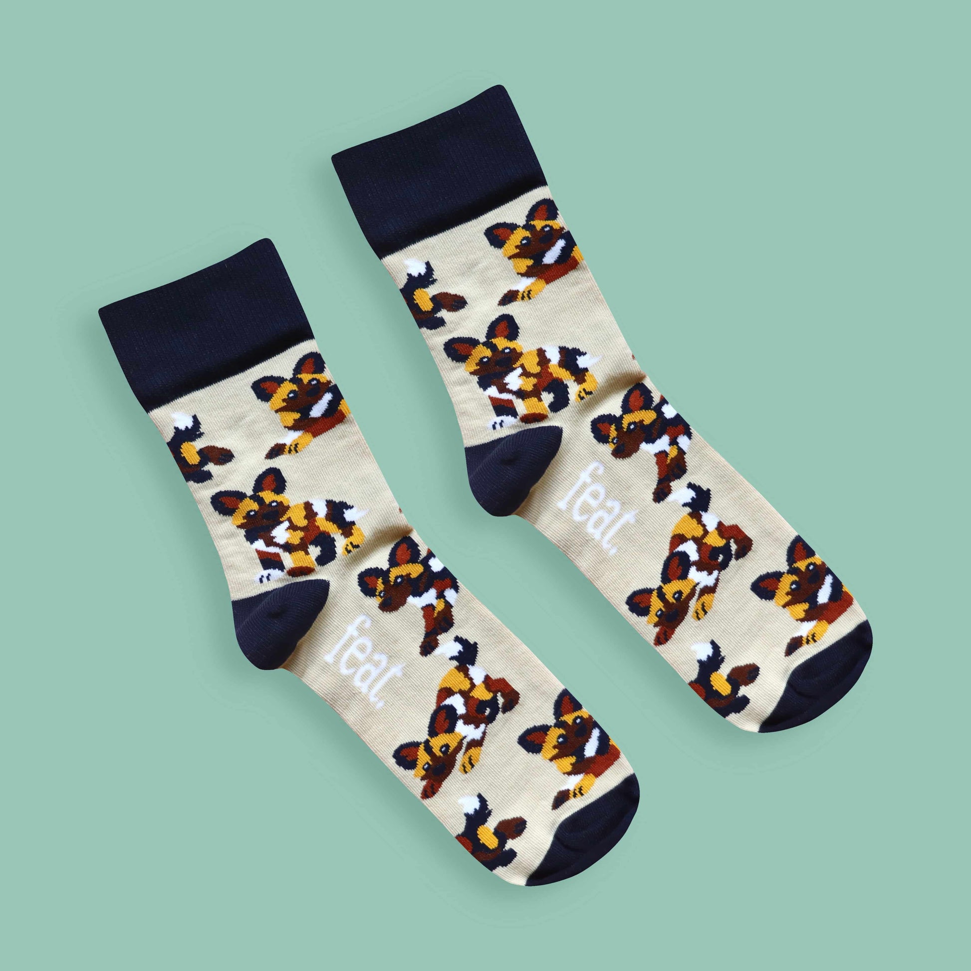 Painted dog socks green background diagonal